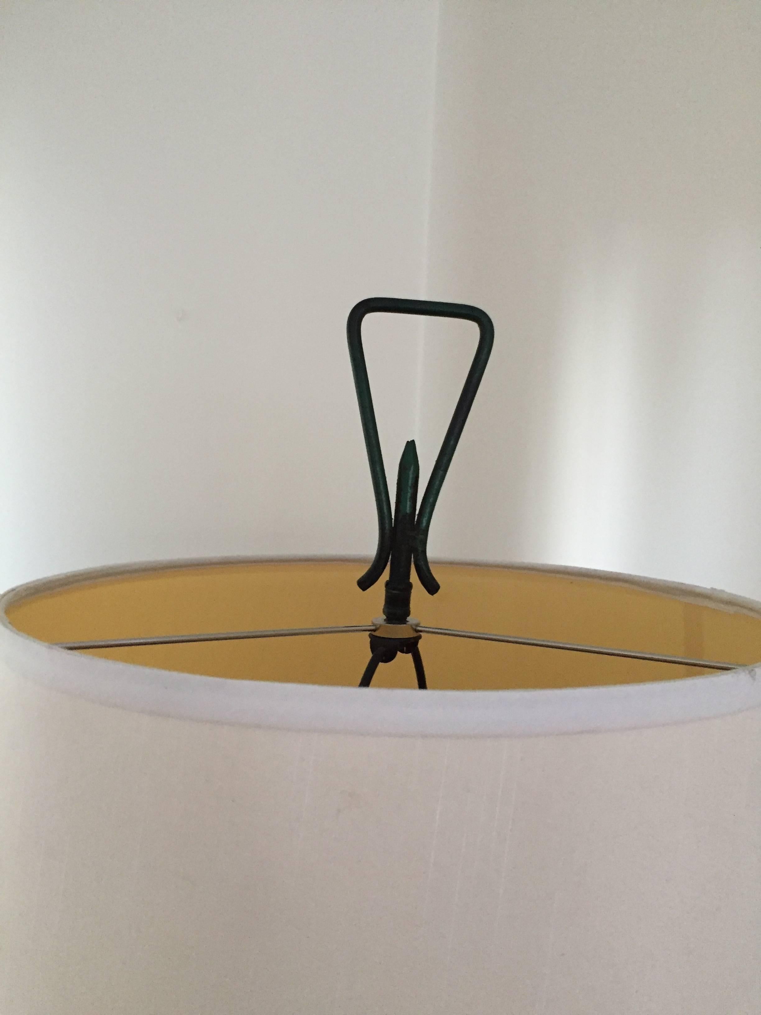 Bent tube metal hairpin base with verdigris finish and decorative pierced metal lantern basket element.  Single socket. Original finial. 