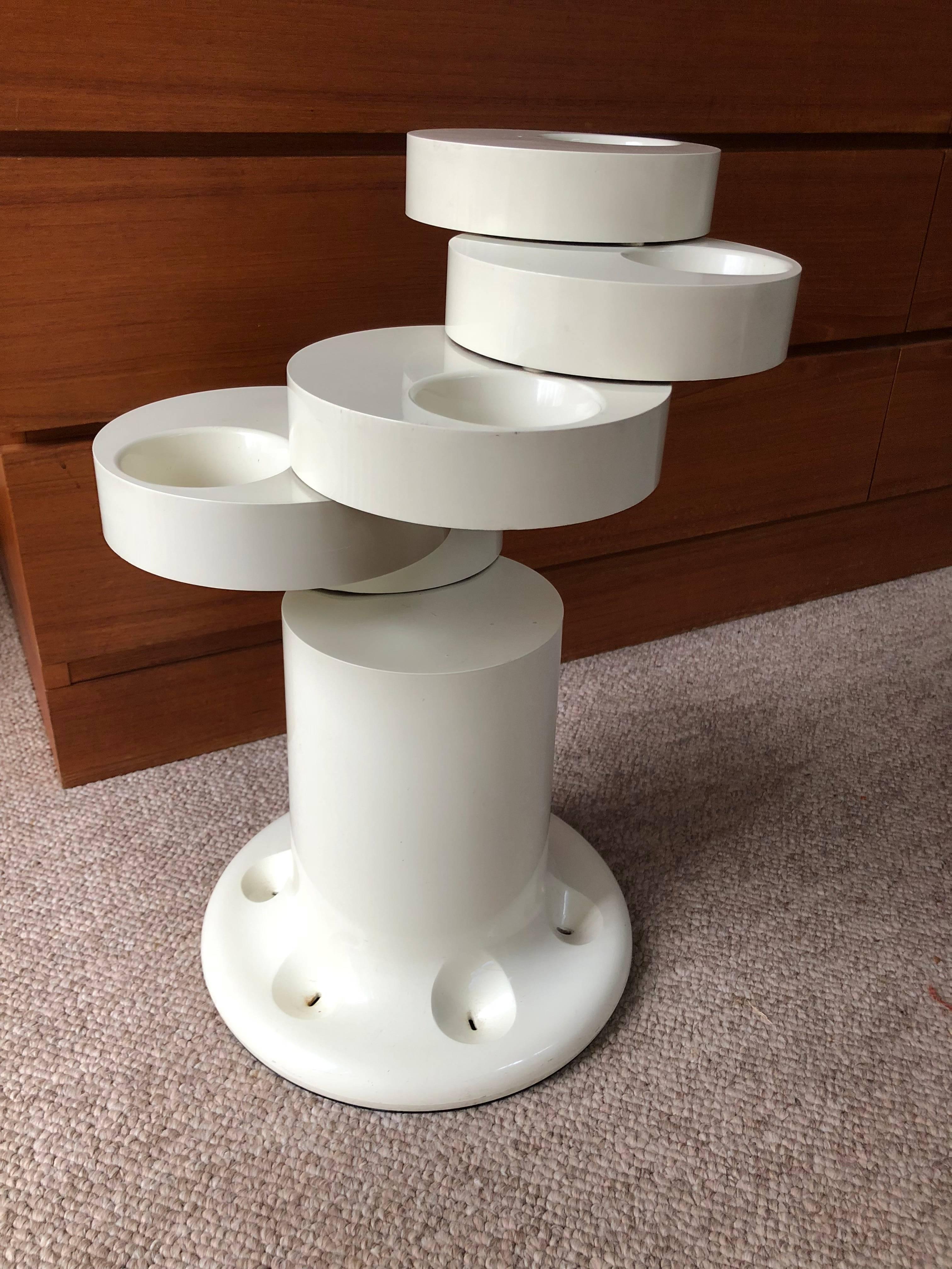 Pluvium umbrella stand by Giancarlo Piretti for Anonima Castelli, circa 1970. Hinged plastic rings on the stand open individually to accommodate up to six umbrellas. Molded signature to underside.