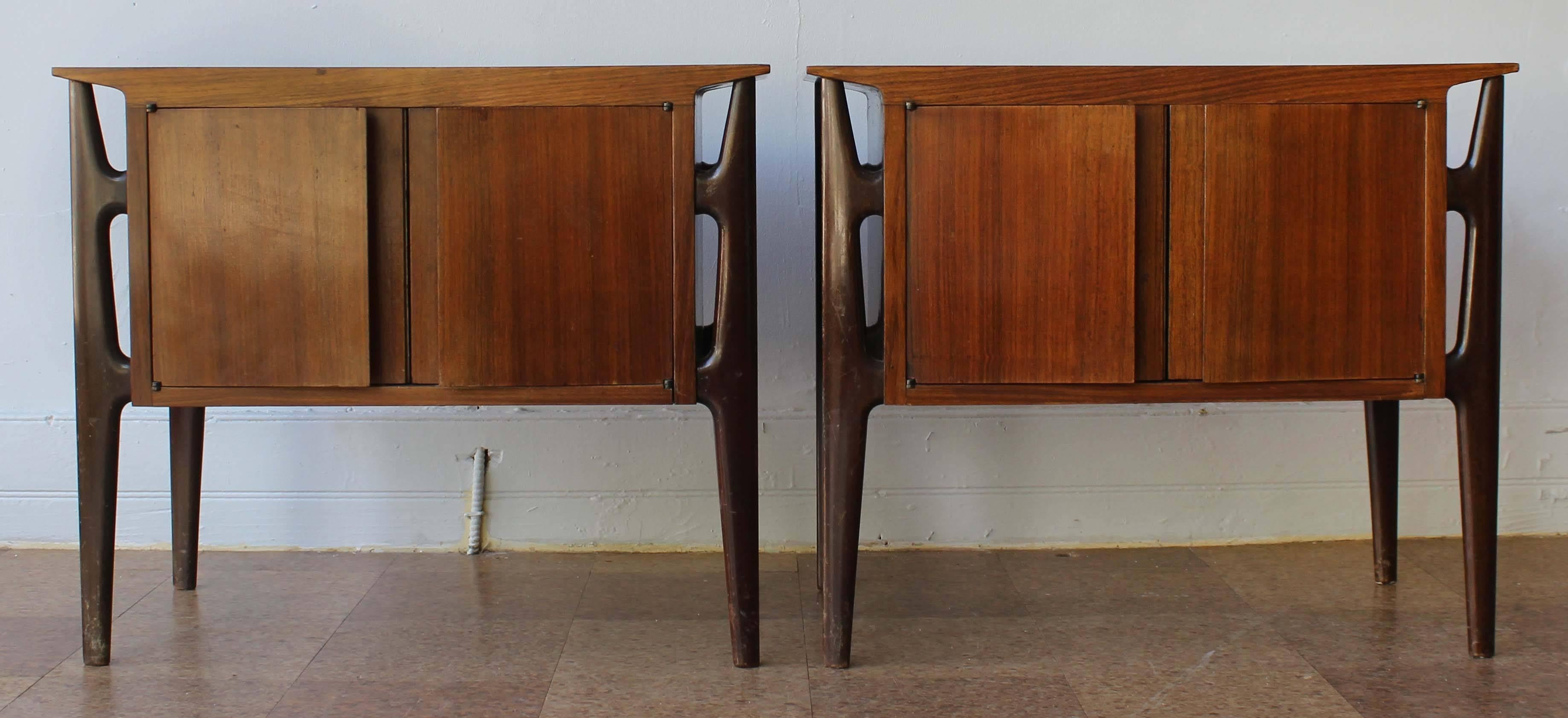 A pair of Italian Mid-Century rosewood and mahogany nightstands in the style of Carlo di Carli. Matching dresser also available see photos.