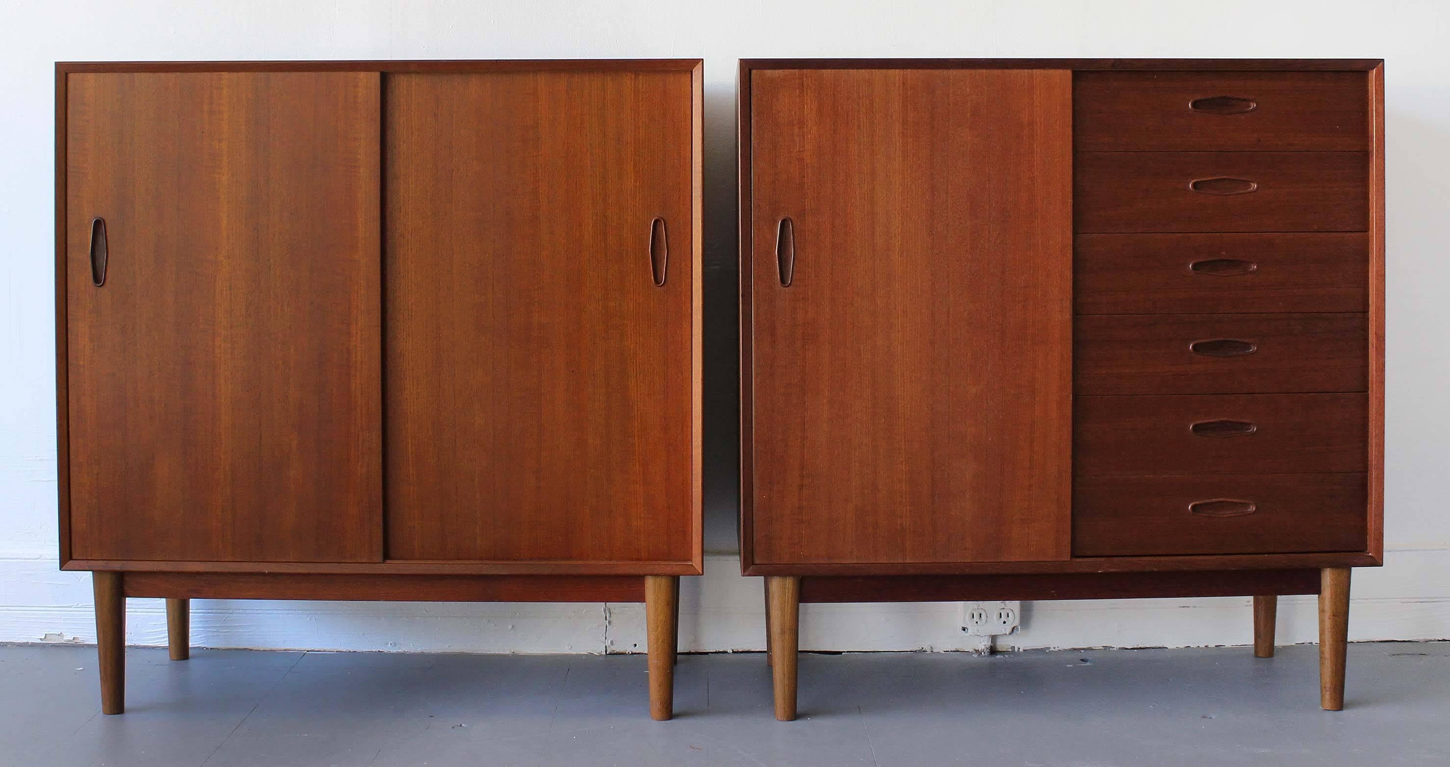 A mixed pair of Mid-Century teak cabinets by Nils Jonsson for Hugo Troed, Sweden.