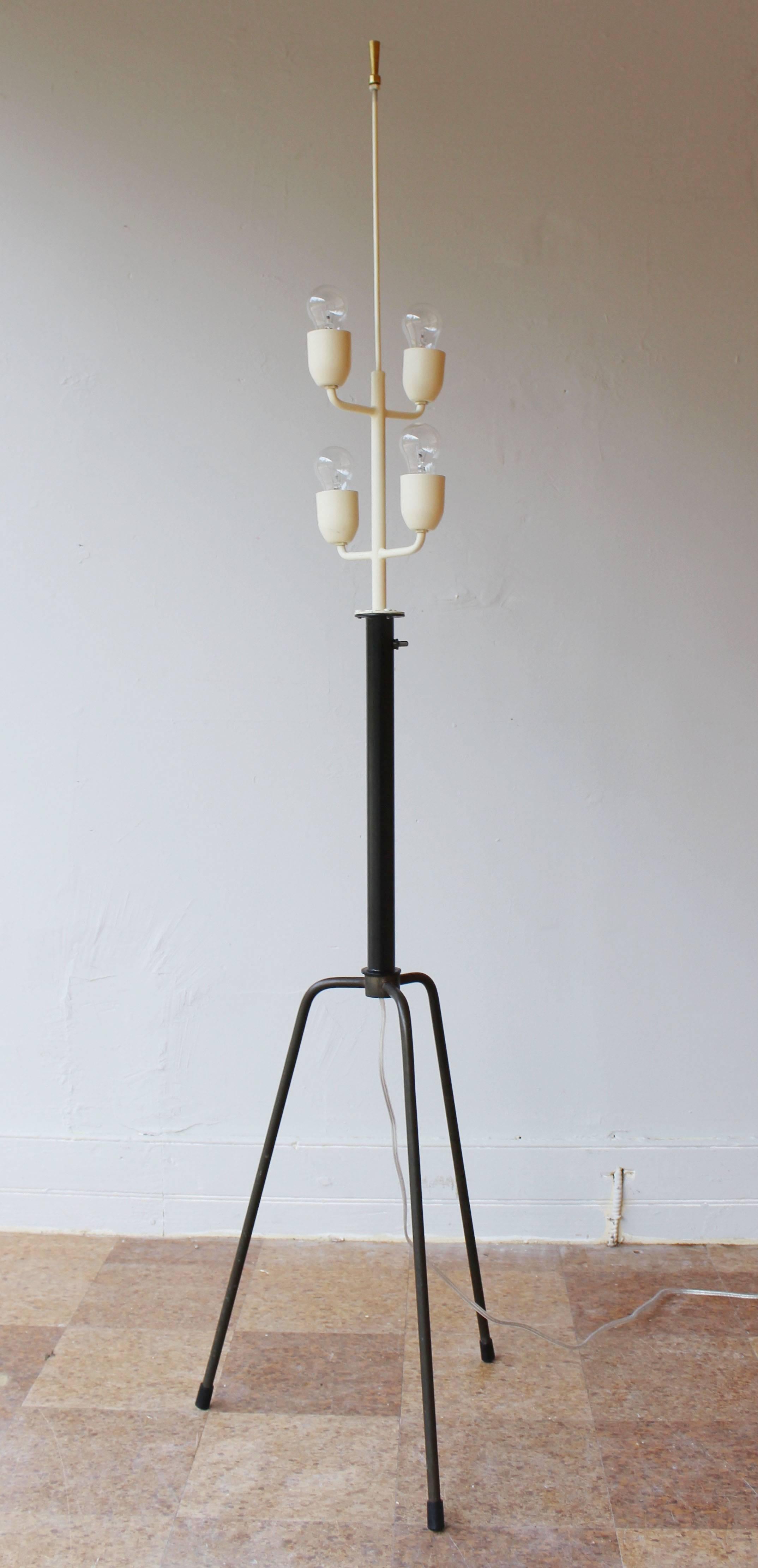 An early Italian patinaed brass and enameled metal floor lamp with 4 sockets.

restored and rewired.