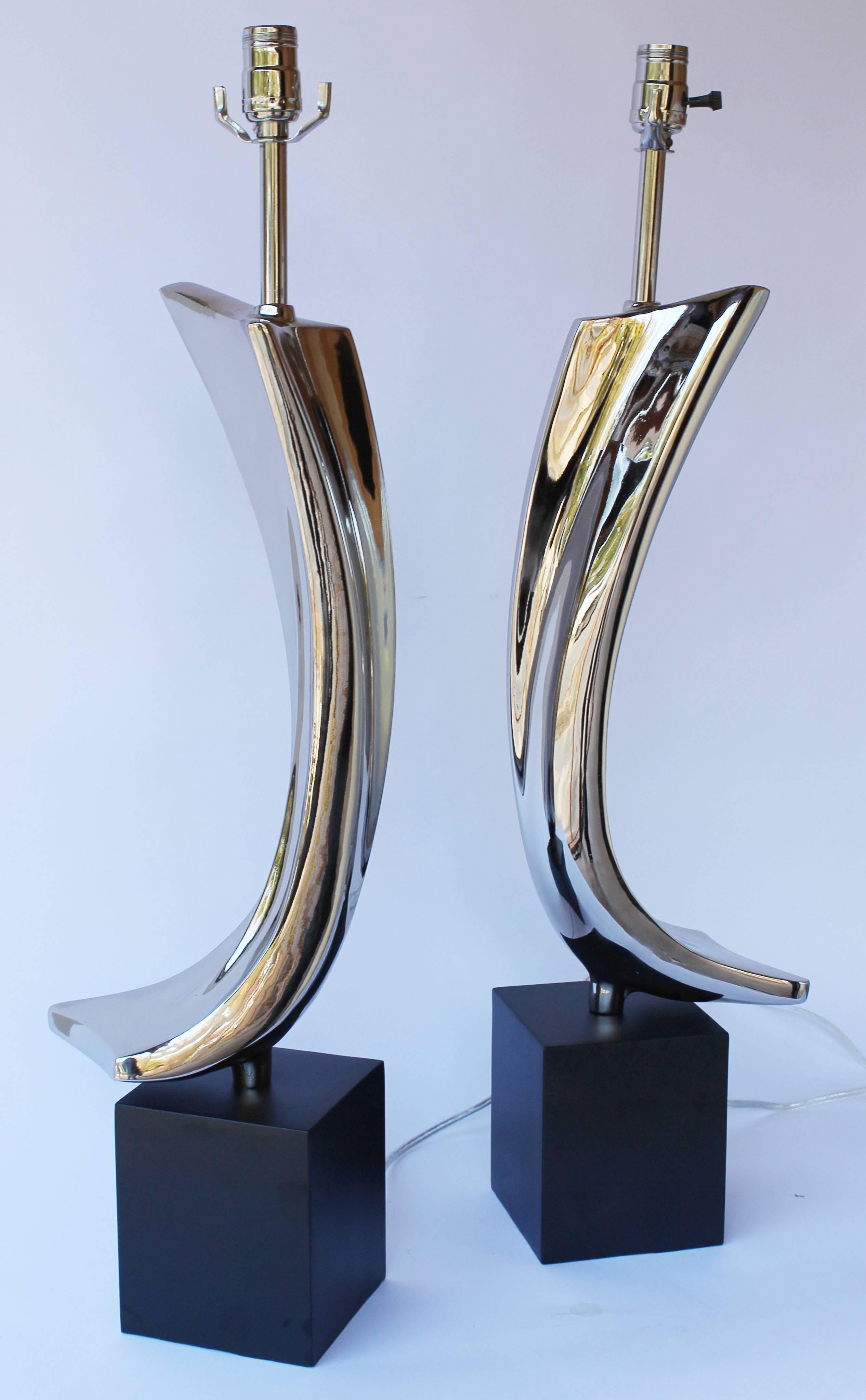 A pair of nickel-plated Laurel lamps.

 