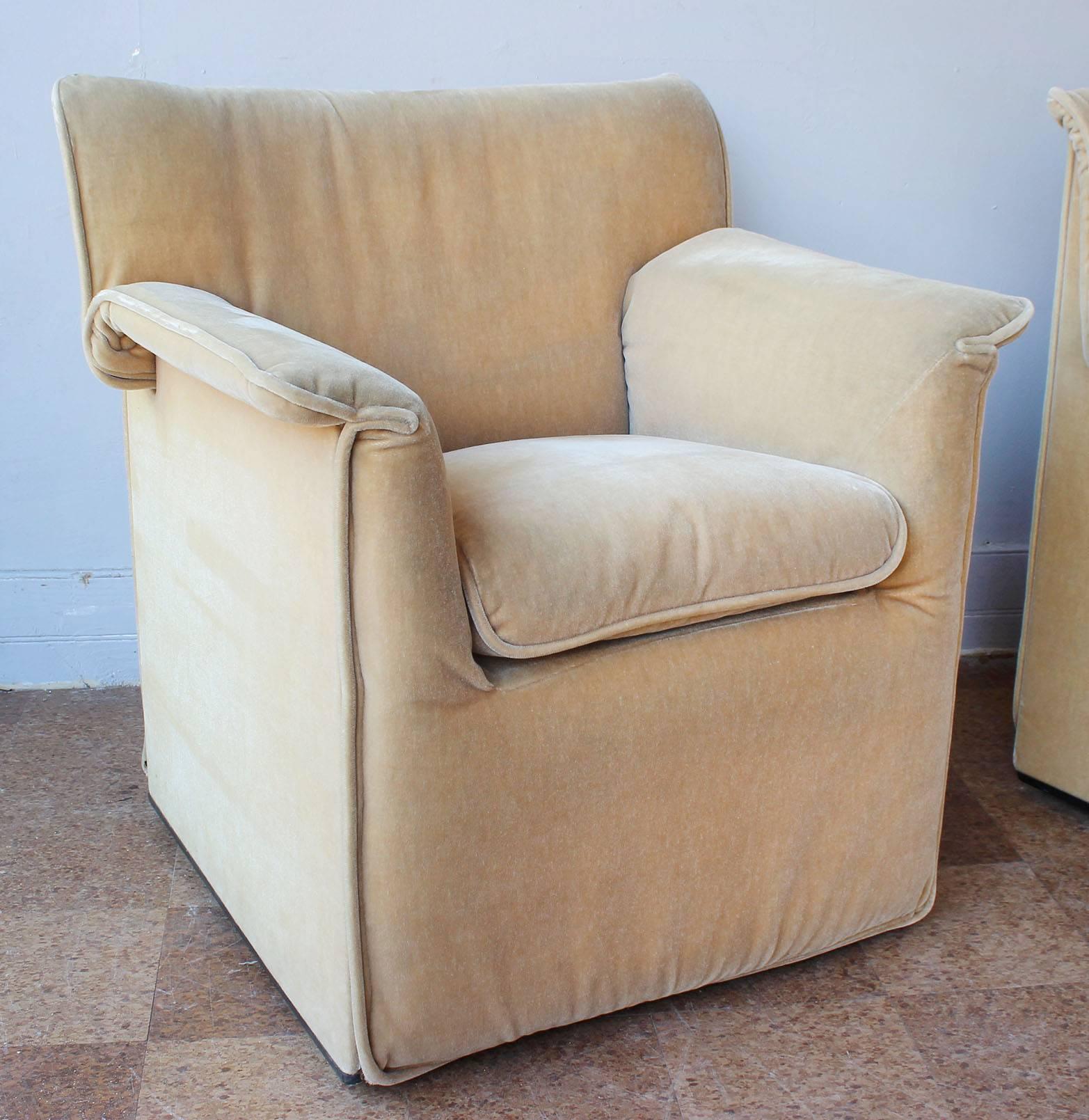 A cozy pair of Tobia Scarpa for B & B Italia armchairs in original pinky-beige wool velvet upholstery, on casters.

complementary upholstery within 30 miles.