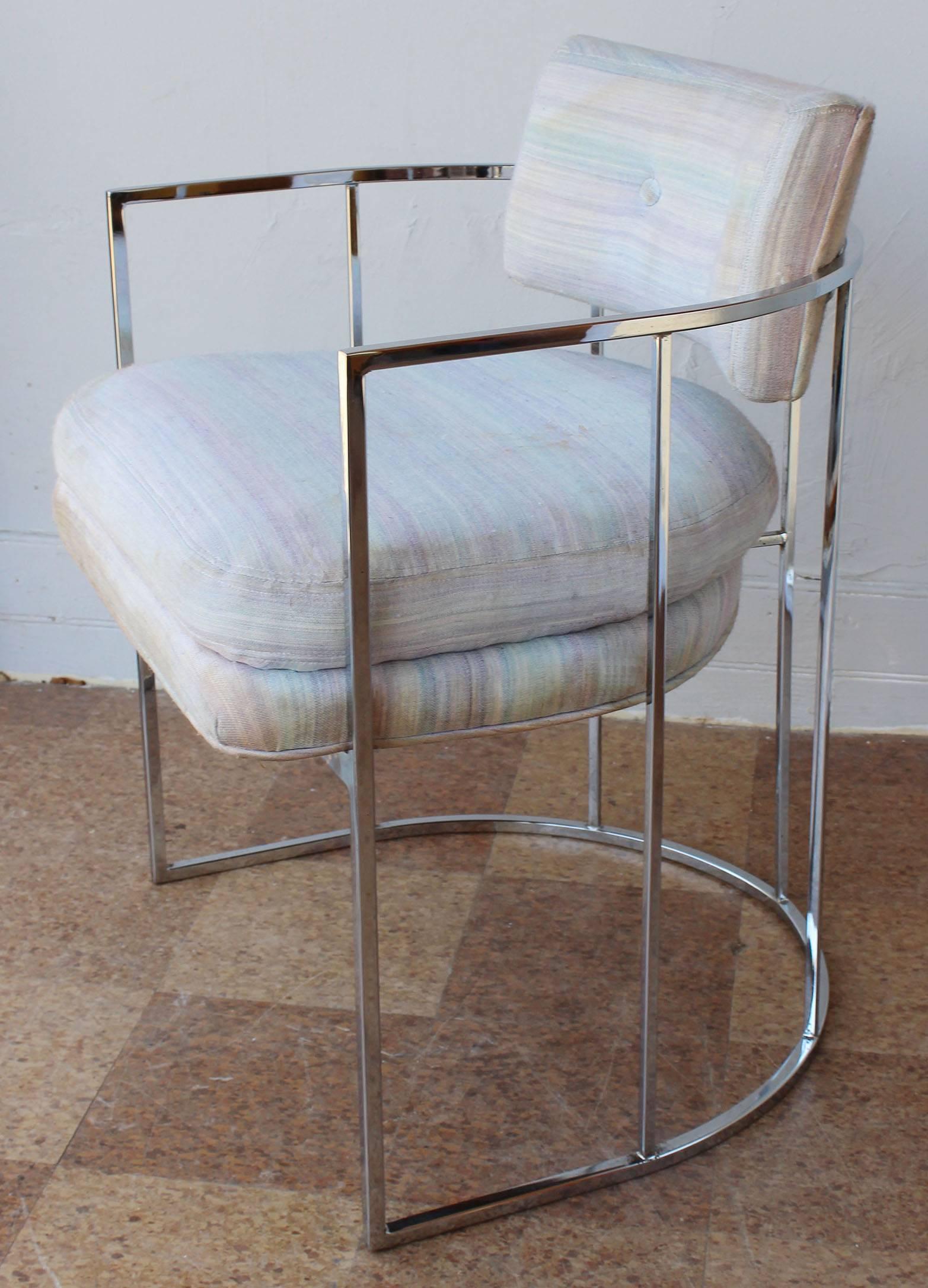 A pair of tubular chrome barrel back armchairs in original vintage upholstery by Milo Baughman. Complementary delivery within 30 miles.