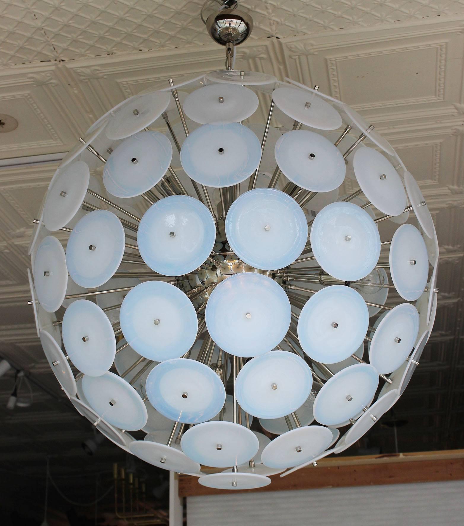 Spectacular modernist Vistosi disc sputnik chandelier. 95 round Murano iridescent glass disks and new chromed steel hardware. Each disk is 6