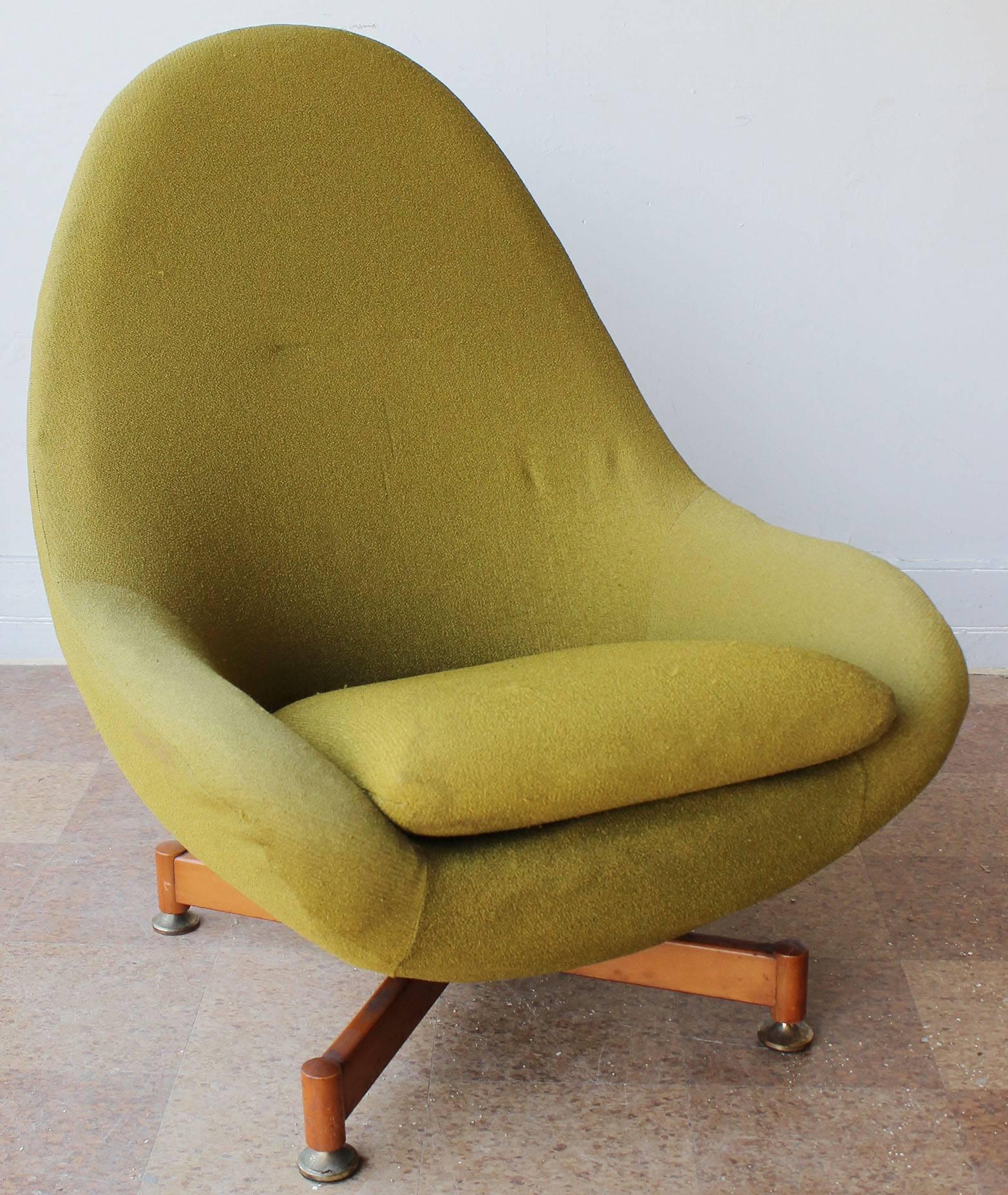 A single swivel chair on wood base in vintage original upholstery, with brass sabots.

complementary delivery within 30 miles.

