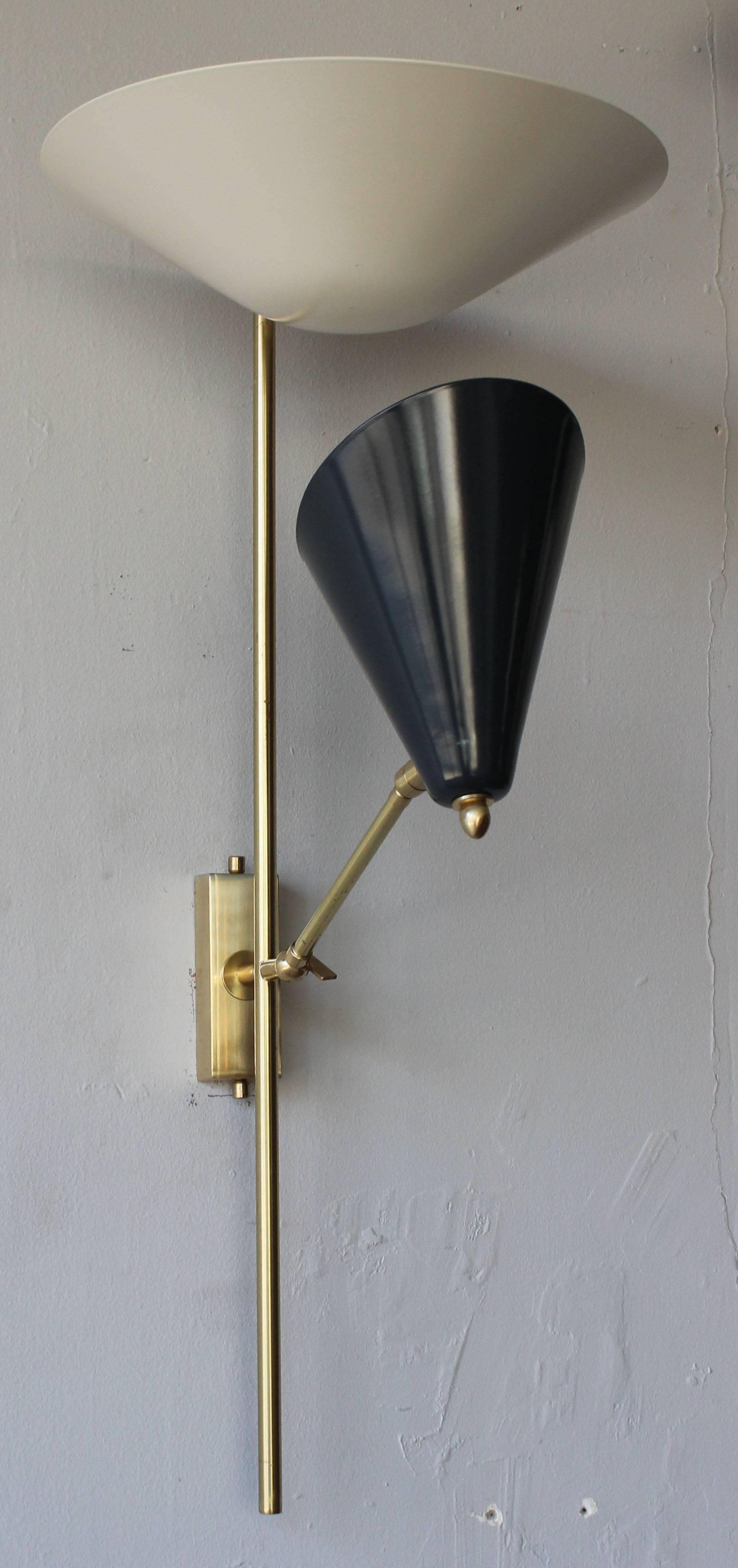 A fabulous pair of limited edition powdercoated aluminum and brass sconces desig.