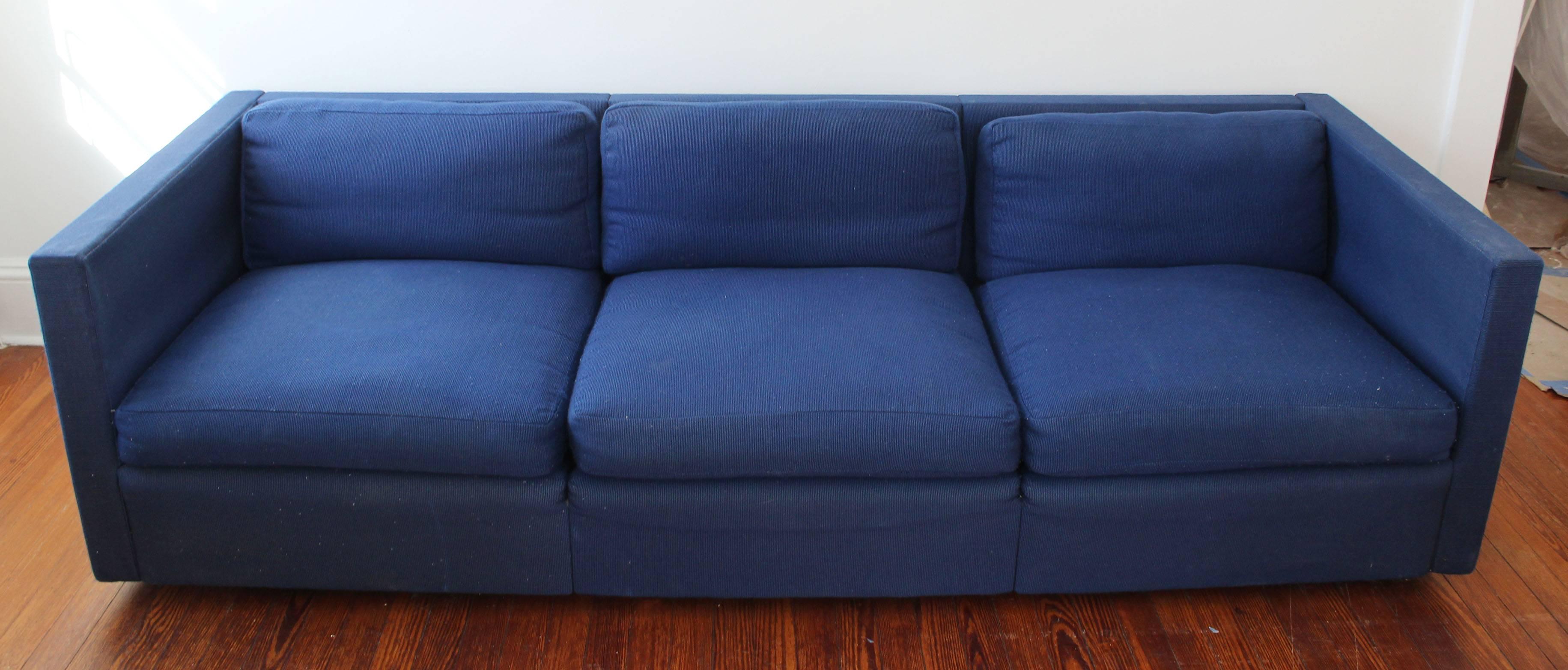 A pair of upholstered tuxedo sofas in modular units. Pieces may be configured as two seat sofa and side chair. Vintage original upholstery. Each piece is on 1.5 inch steel legs.

 