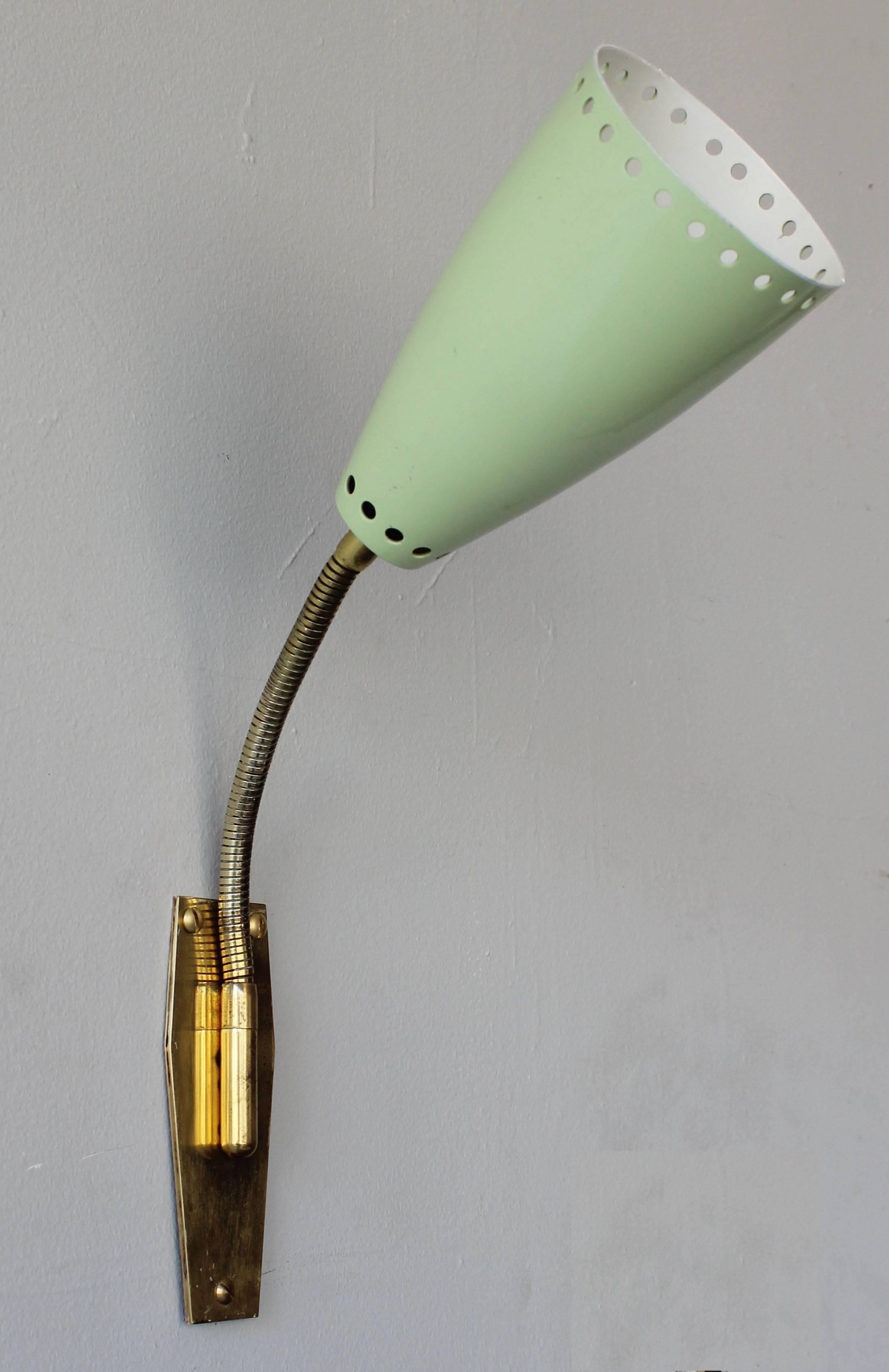 A pair of Italian enameled metal and brass adjustable gooseneck sconces. Two pairs and one single available.

Depth = 11 inches when adjusted to right angle.