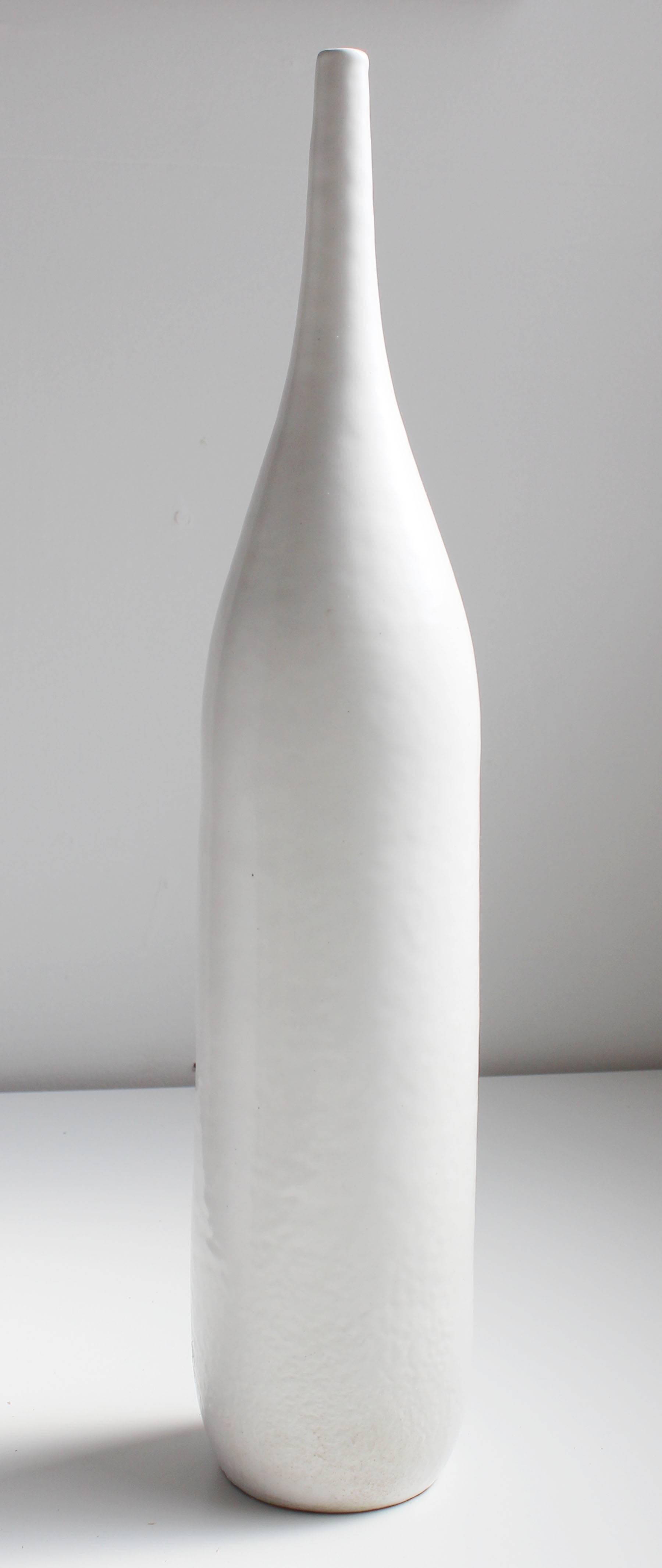 An earthy smooth to rough white glazed terra cotta bottle vase by Raymor Italy.