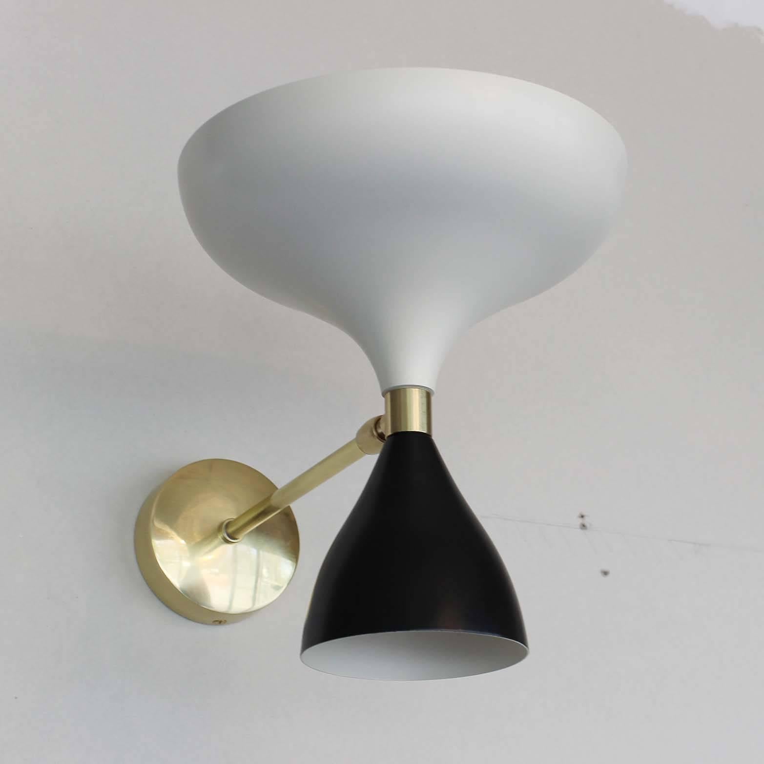 All new spun aluminium sconces in powder coated white or black, or a combination, with brass details. Heads fully rotate with up and down sockets, Stellar Union Exclusive Design. Twelve and six shade chandelier also available, see website and