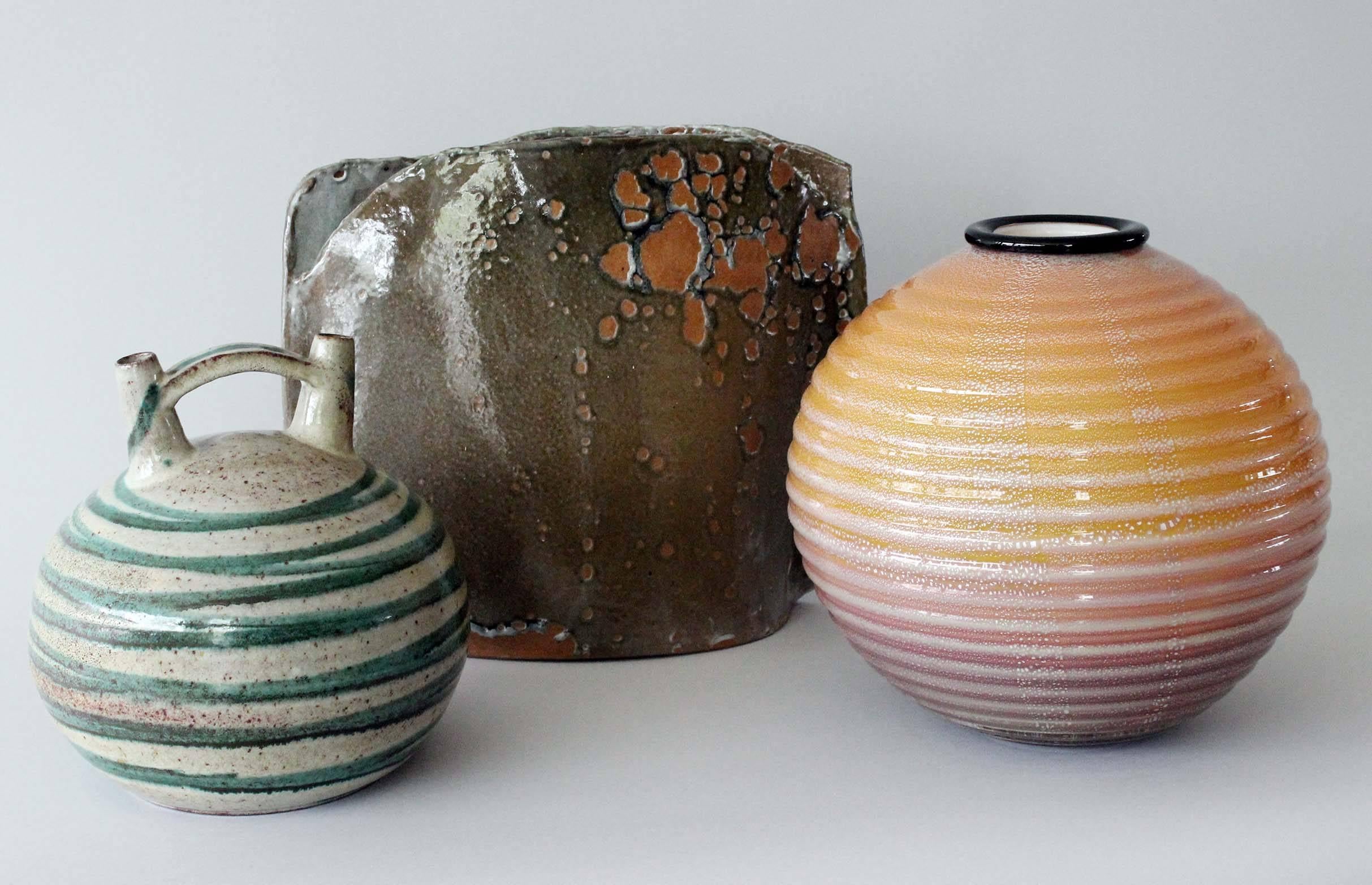 A trio of mid-century Italian ceramic vases and Seguso glass vase.
Pieces sold separately.
Prices to come -- please inquire.