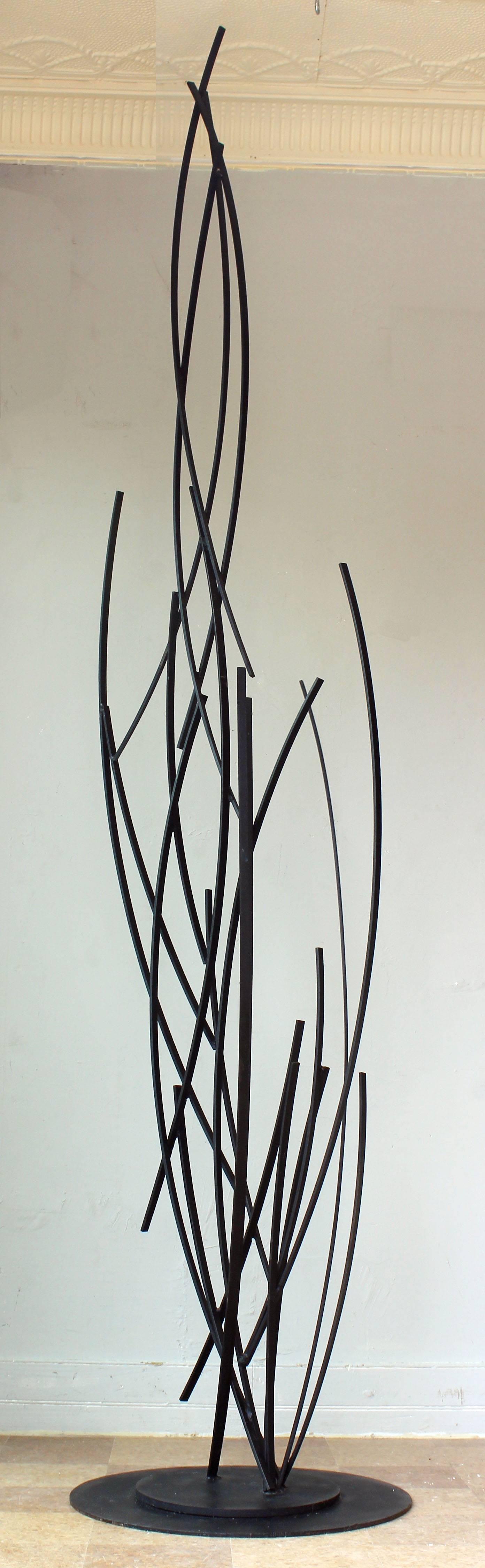 A 1970s American modern abstract iron sculpture, signed.

Measures: 24 inch diameter base.