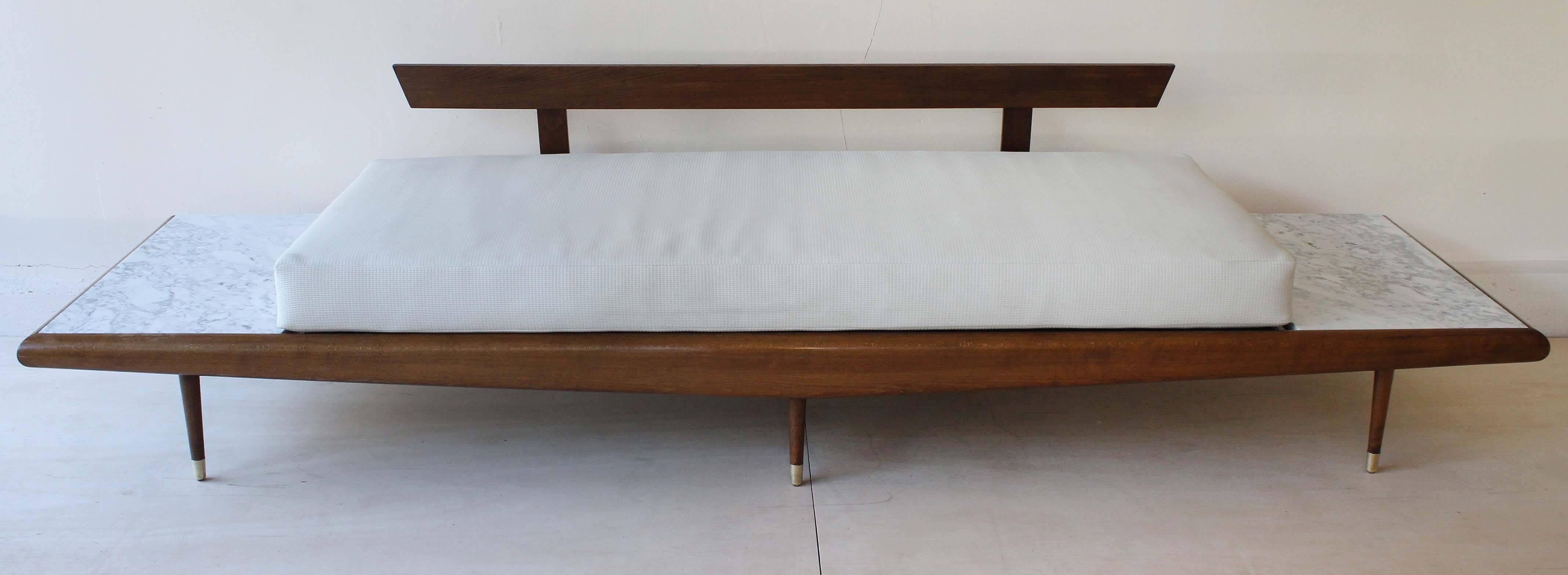 A versatile Adrian Pearsall / Craft Associates walnut and marble sofa, daybed or bench with brass boots. Shown here with 5