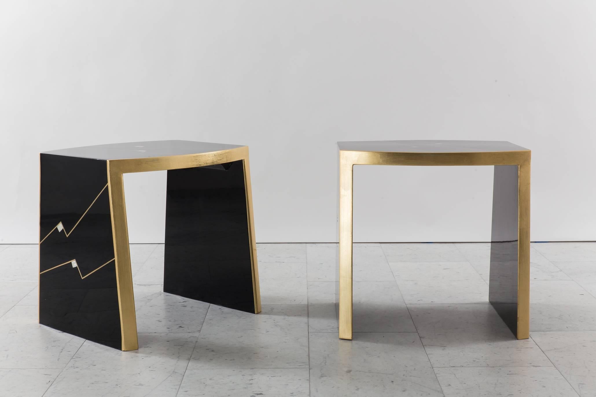 The elegant shape of Ron Seff’s iconic “Ritz” table meets the artist’s masterful execution of luxe materials and inlay. Evocative of the era in which they were made, the glamorous pair is energized by a zigzag design across a black lacquered