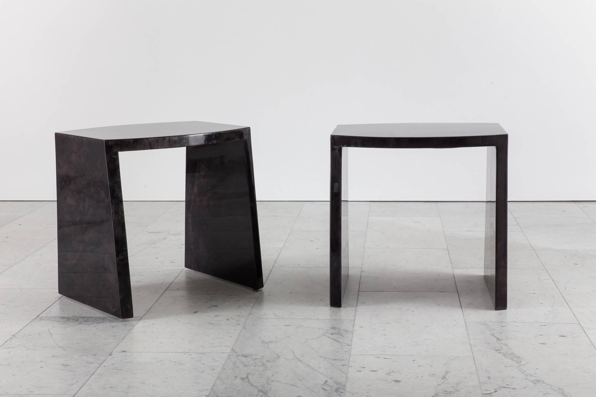 The elegant shape of Ron Seff’s iconic “Ritz” table meets the artist’s masterful use of exotic materials and finishes. Made of black goat skin and finished in lacquer, the side tables are once sculptural as they are practical.

Todd Merrill Studio