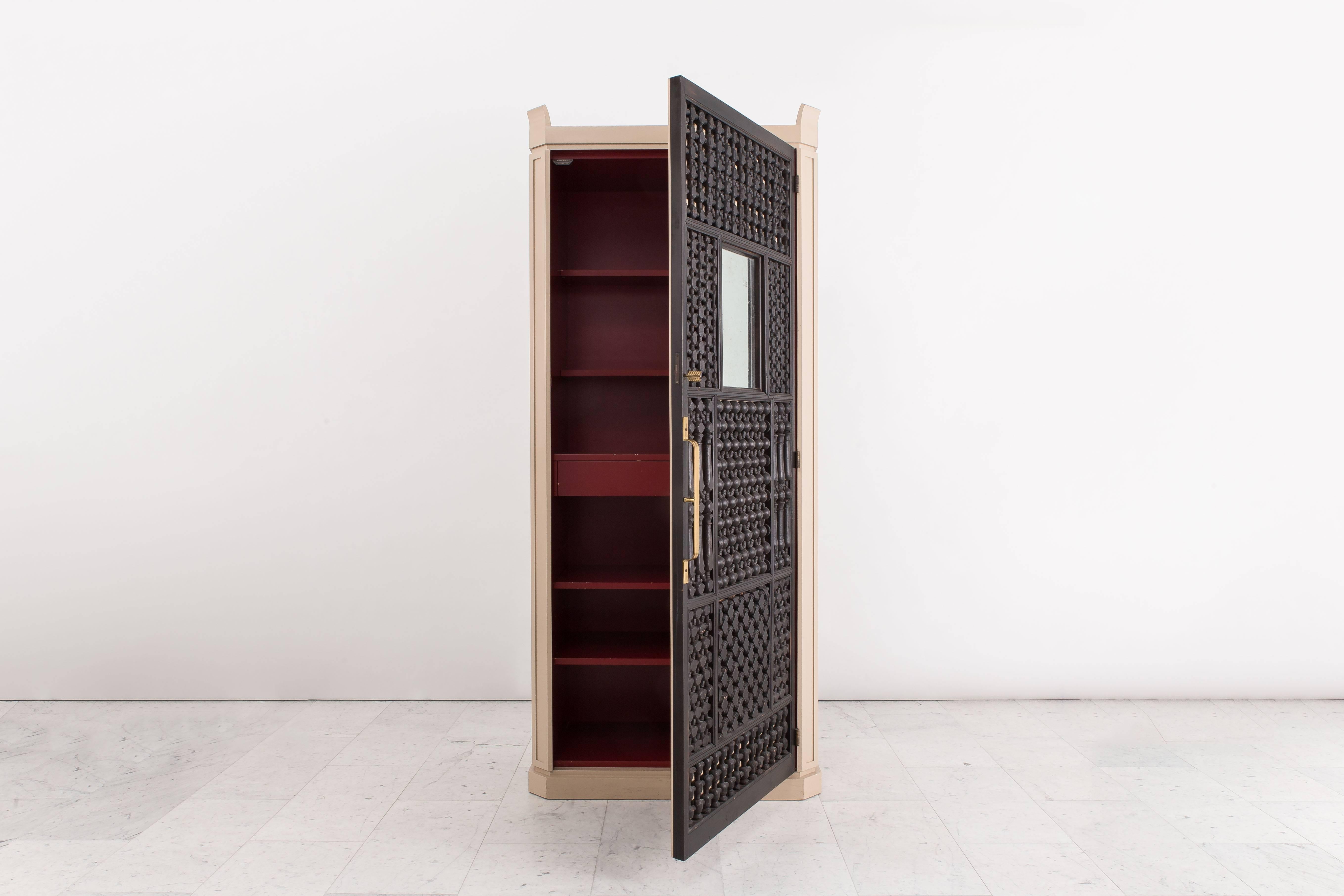 An entirely original cabinet or bar designed and produced by Tommi Parzinger in the early 1950s, this beautiful piece comes from his second show room that was located at 32 East 57th Street in Manhattan.

The tall cabinet, made with clean, modern