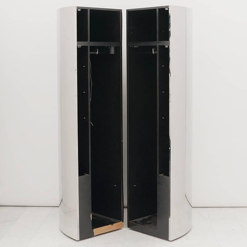 This unique set of three monumental polished steel semi-cylindrical cabinets is a wonderful example of Evans’ architectural and futuristic furniture pieces created at the end of his prolific career in the 1980s. Evocative of the era in which they