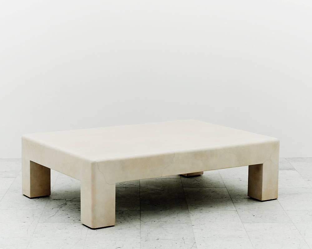 
A low table made with the free-form inlay of natural ivory goatskin with a polished lacquered finish. Springer's elegant form is a reinterpretation of the iconic Parsons table, a design developed by Jean-Michel Frank in the 1930s at the Parsons