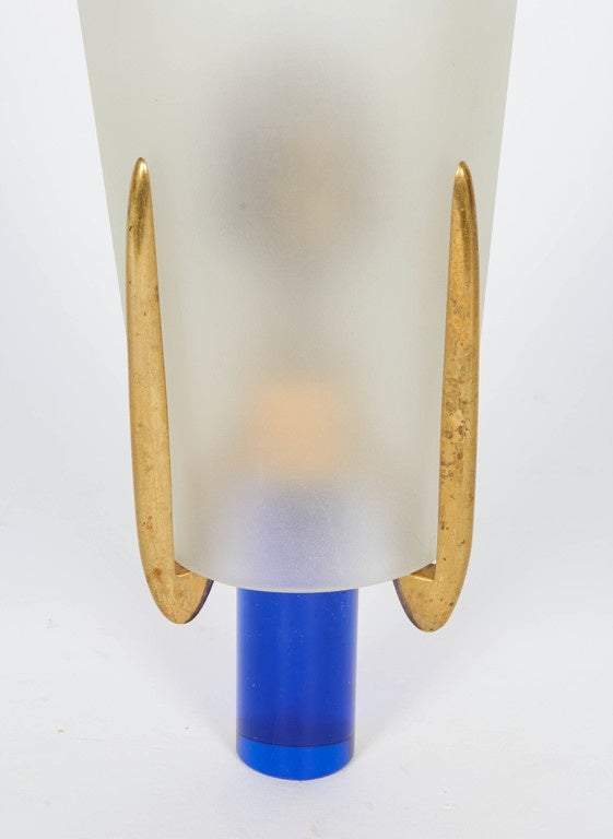 Bronze and blue glass base surmounted by a frosted glass shade. 
One pair listed.
Also a single one available.