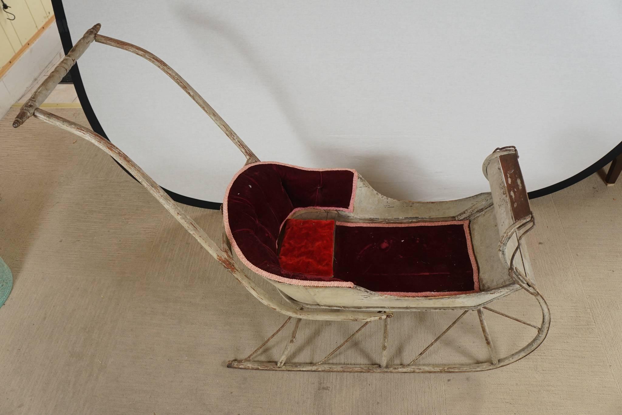 Small painted children's Sleigh . With handle for pushing. 