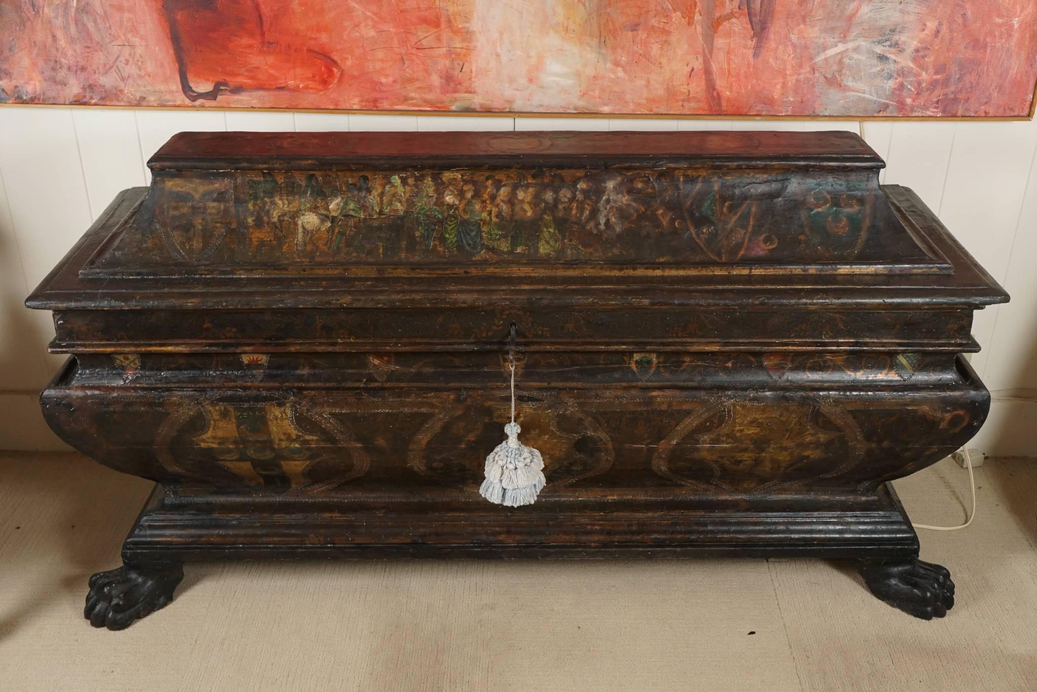 Beautifully shaped Italian Cassone, storage cabinet or blanket chest. Having large paw feet in front and sledge feet in the back. Painted surface, with some restoration.