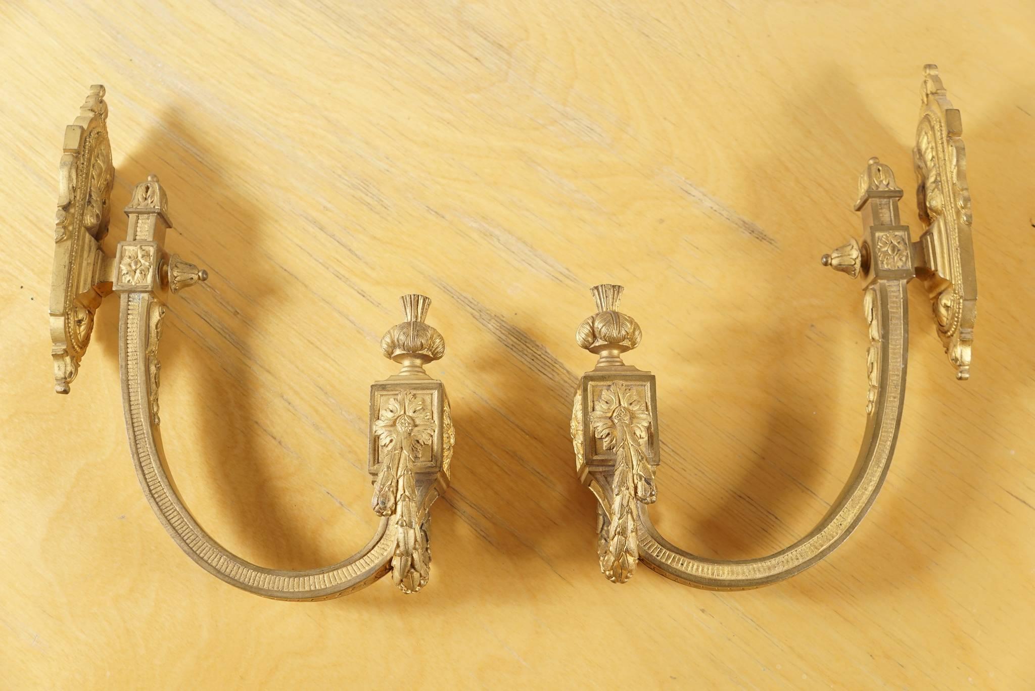 a Pair of Tie backs used for Curtains, French from the 1800's.  Gilded Bronze