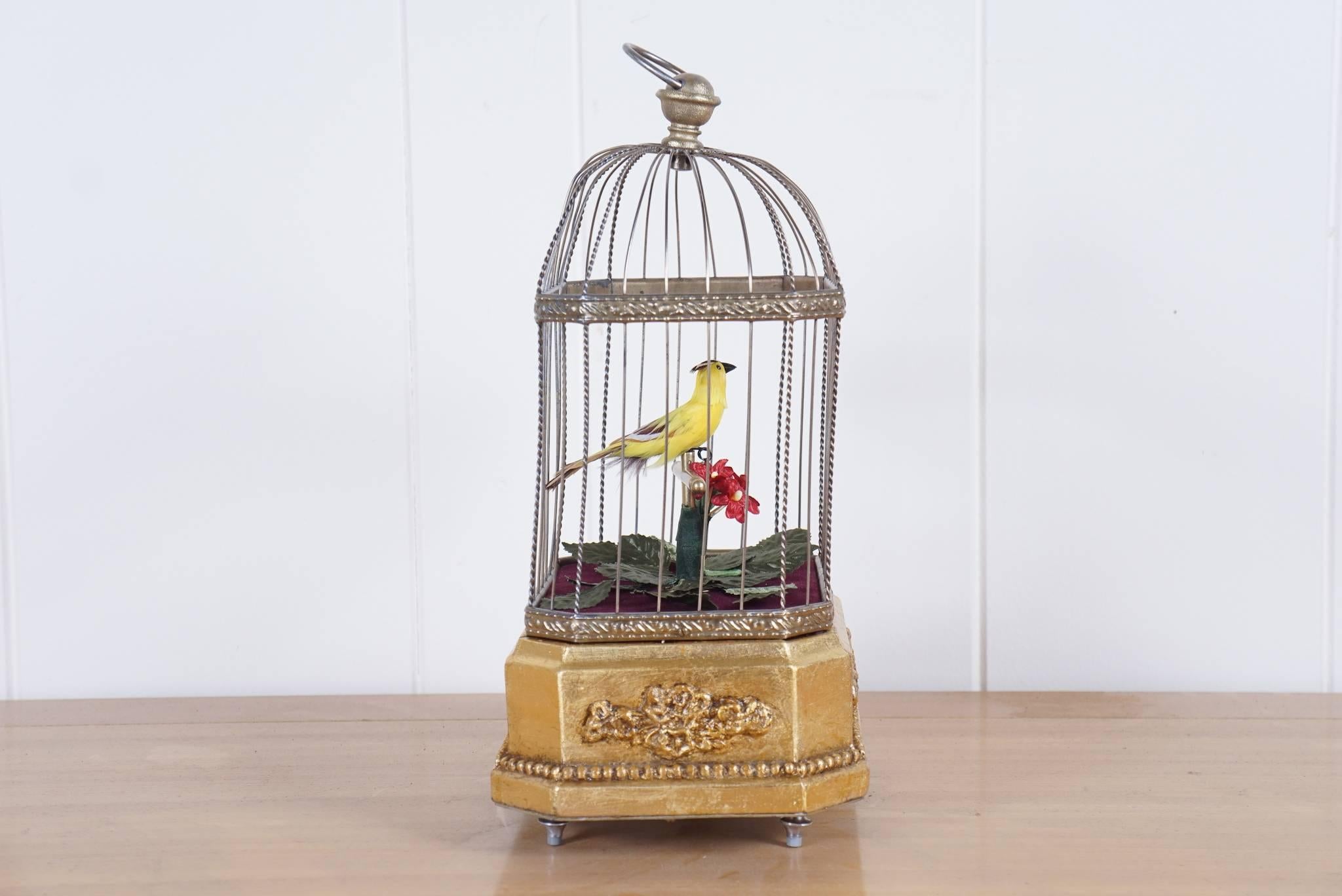 Small Birdcage which contains within a miniature automaton singing bird.  This example is a 1910 Bontems.