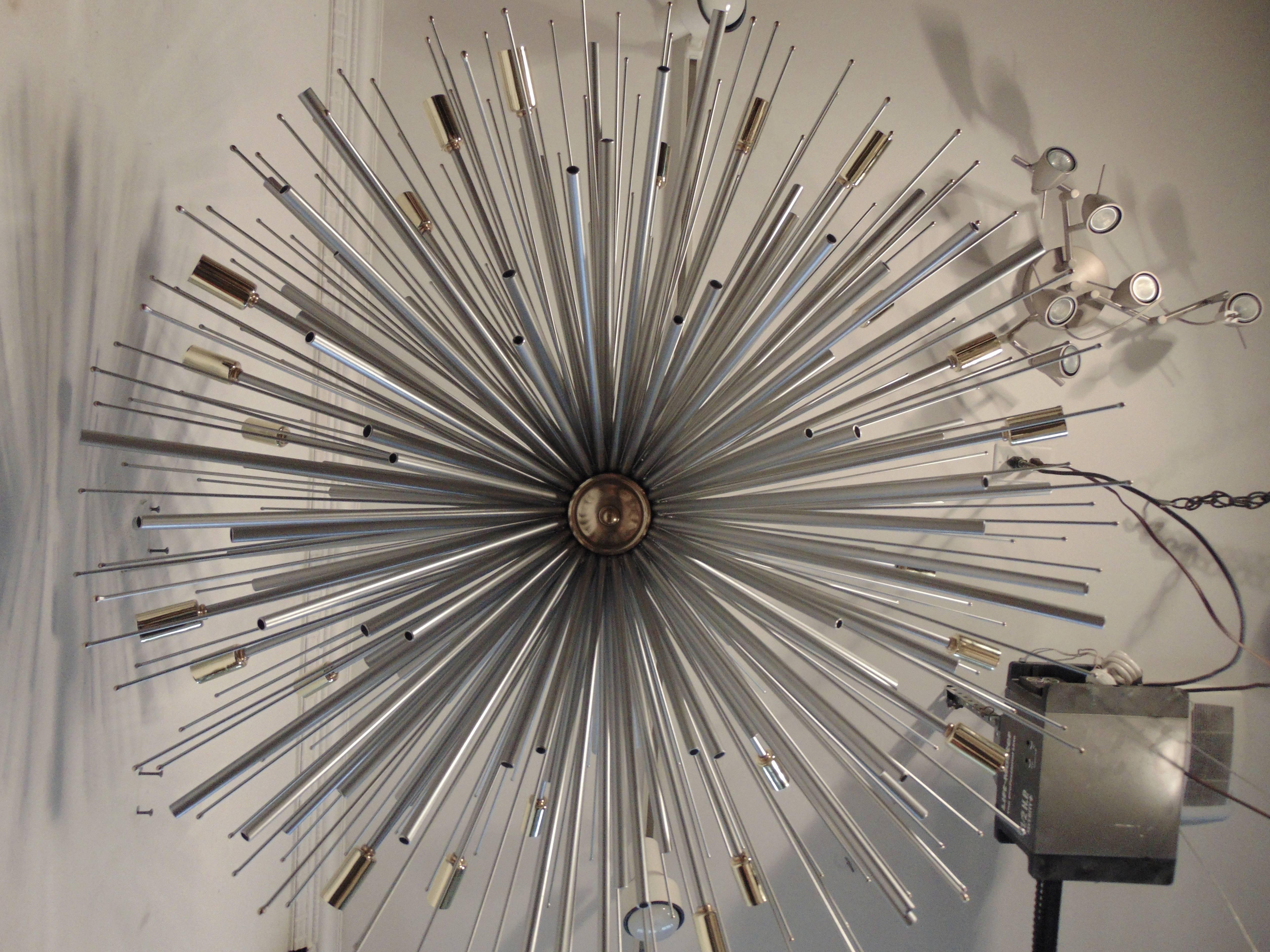 A full array style supernova chandelier by Lou Blass. Custom-made to size and finish. The diameter is 30
