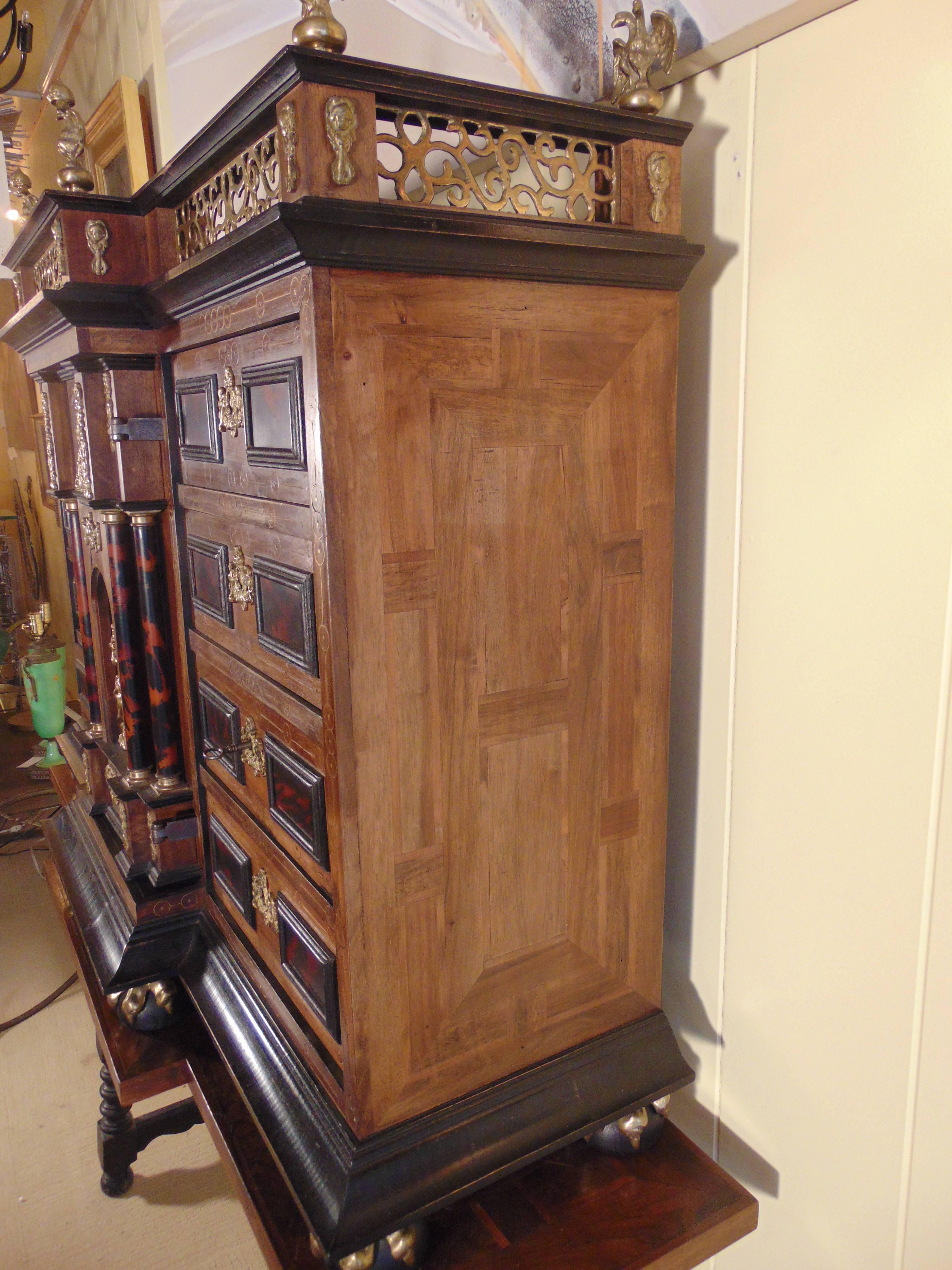 This is a finely crafted reproduction Vargueño with stand.