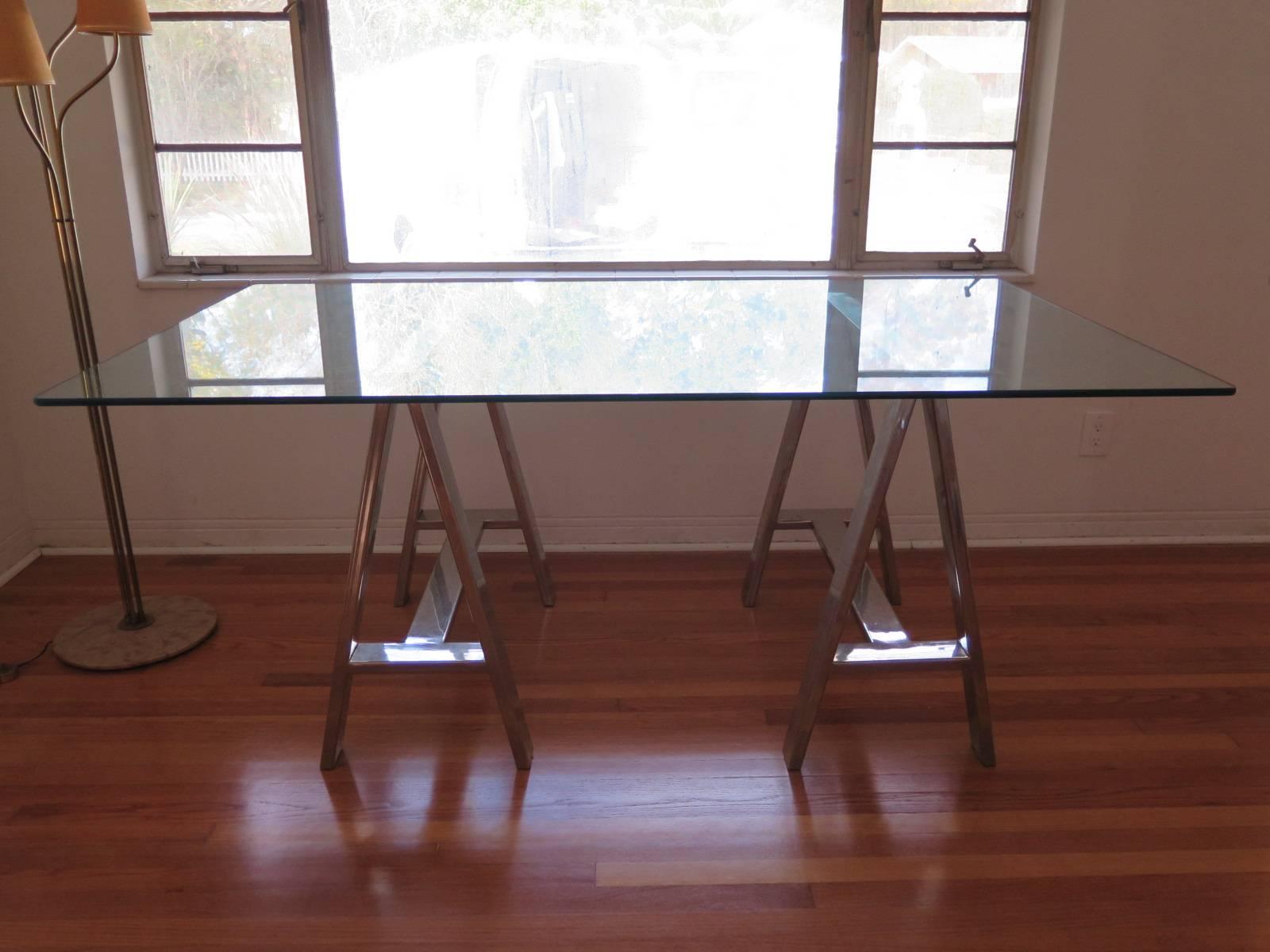 An interesting steel and glass trestle table-dining height.