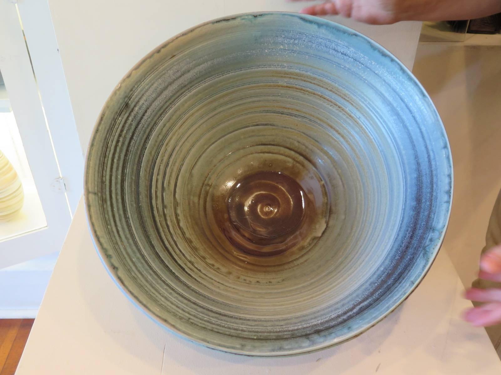 A Charlie Parker gas fired stoneware bowl-unique example in rutile blue and nebula glaze. A quick note about the artist: Charlie Parker’s ceramic career began in 1967, at the age of 14 when he joined Minnesota Clay Company as a part time clay mixer.
