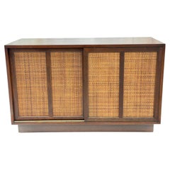 A Classic Mid Century Credenza With Sliding Caned Doors