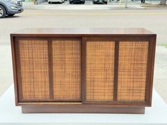 A Classic Mid Century Credenza With Sliding Caned Doors
