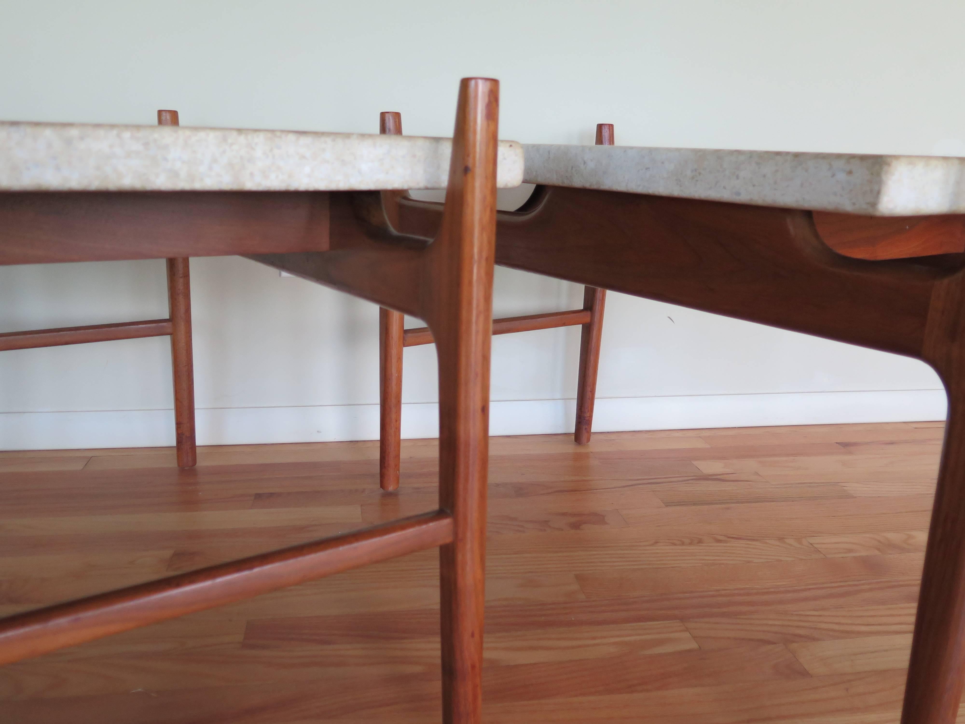 A pair of rare Harvey Probber terrazzo tables. Floating trapezoid tops on organic walnut frames.