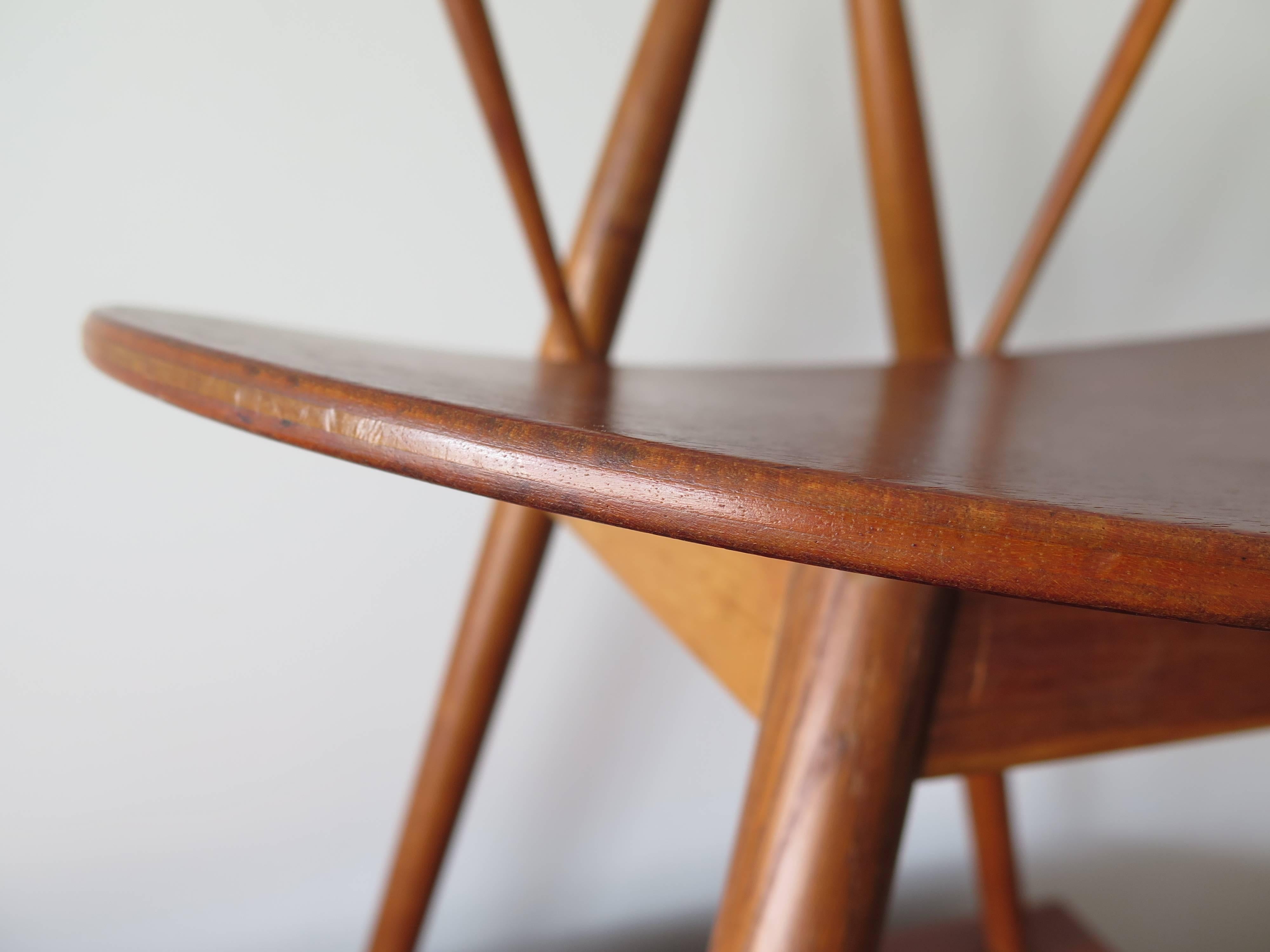 A rare teak and oak piano chair designed by Vilhelm Wohlert for Illums Bolighus in Denmark. The sculptural chair exhibits exceptional craftsmanship with wooden cone-shape turned spacers under the laminated seat. Made of oak, teak and laminated seat.