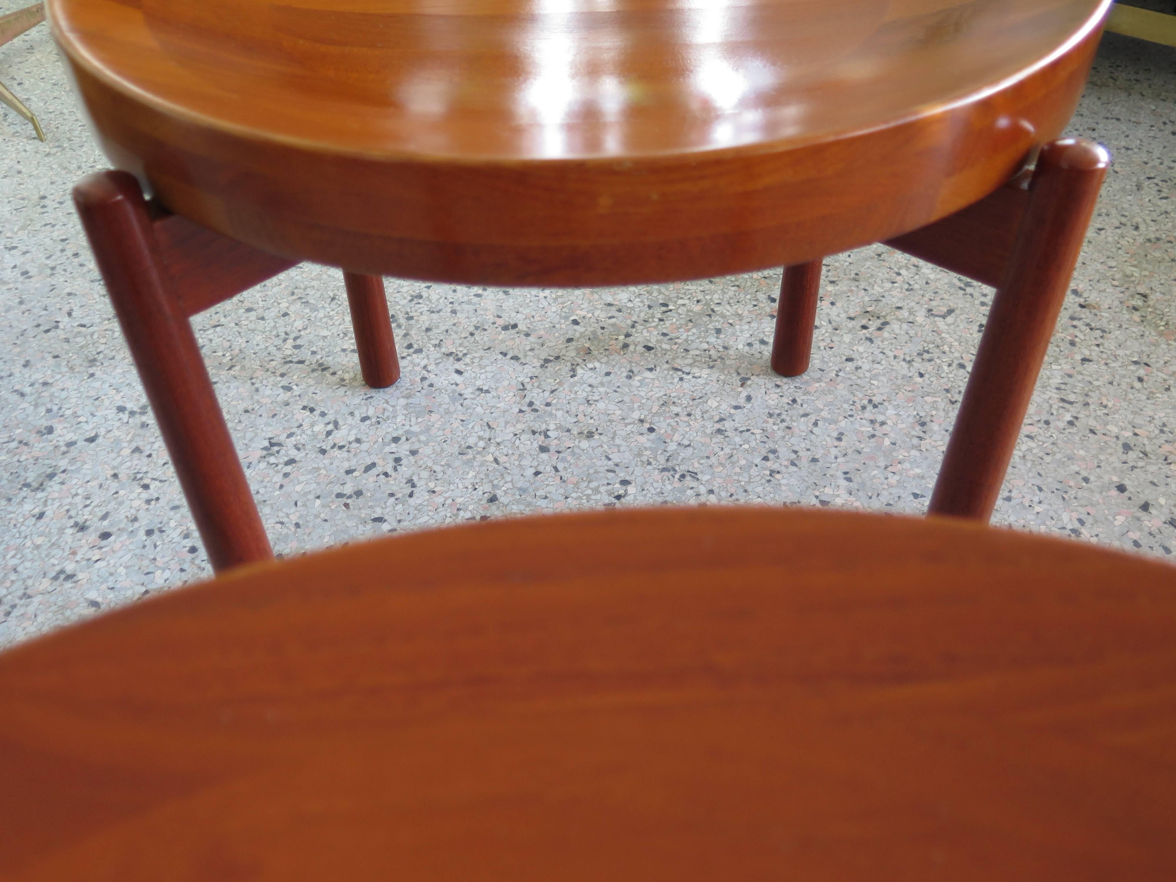 A pair of Classic Danish tables by Jens Guistgaard, thick, laminated, removable tobs. X bases with rounded legs.