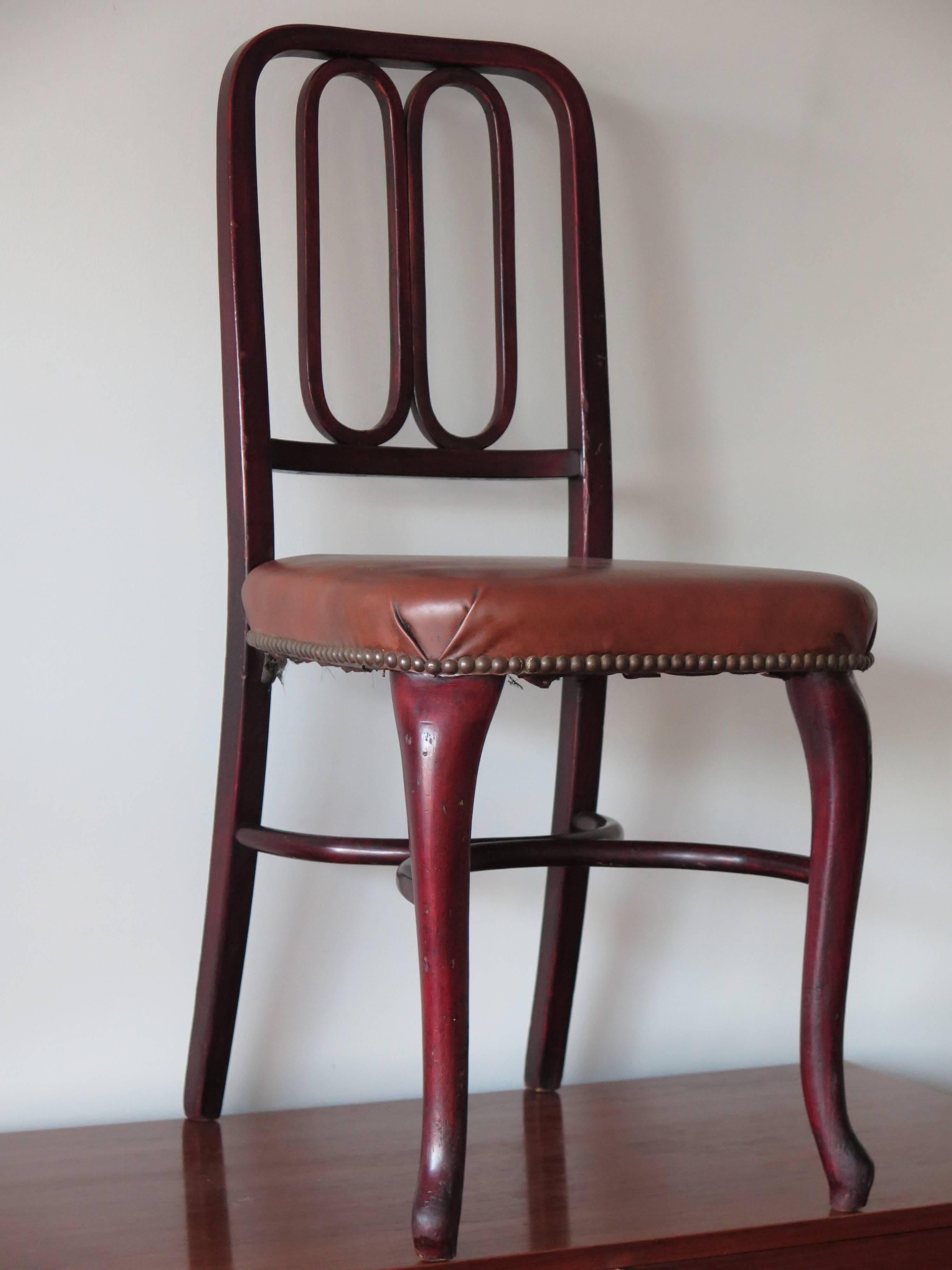 A rare, Thonet bentwood chair with original labels and upholstery. Made in Vienna, Austria and sold in NYC.
