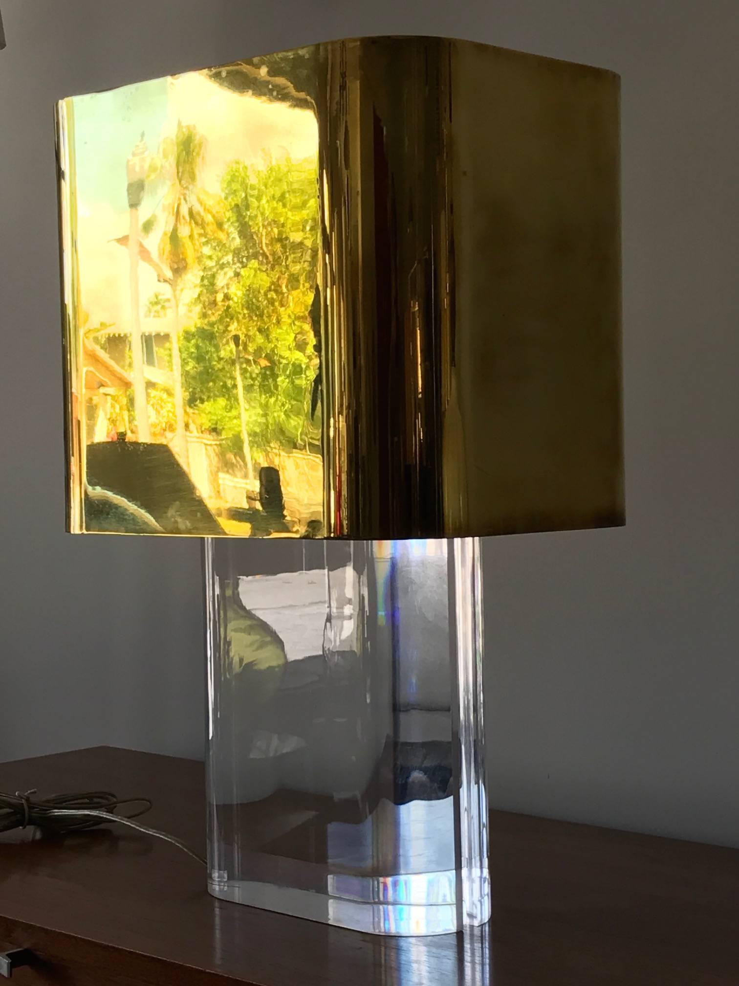 A rare Karl Springer table lamp. Lucite with polished brass shade. Included original receipt, from 1980.