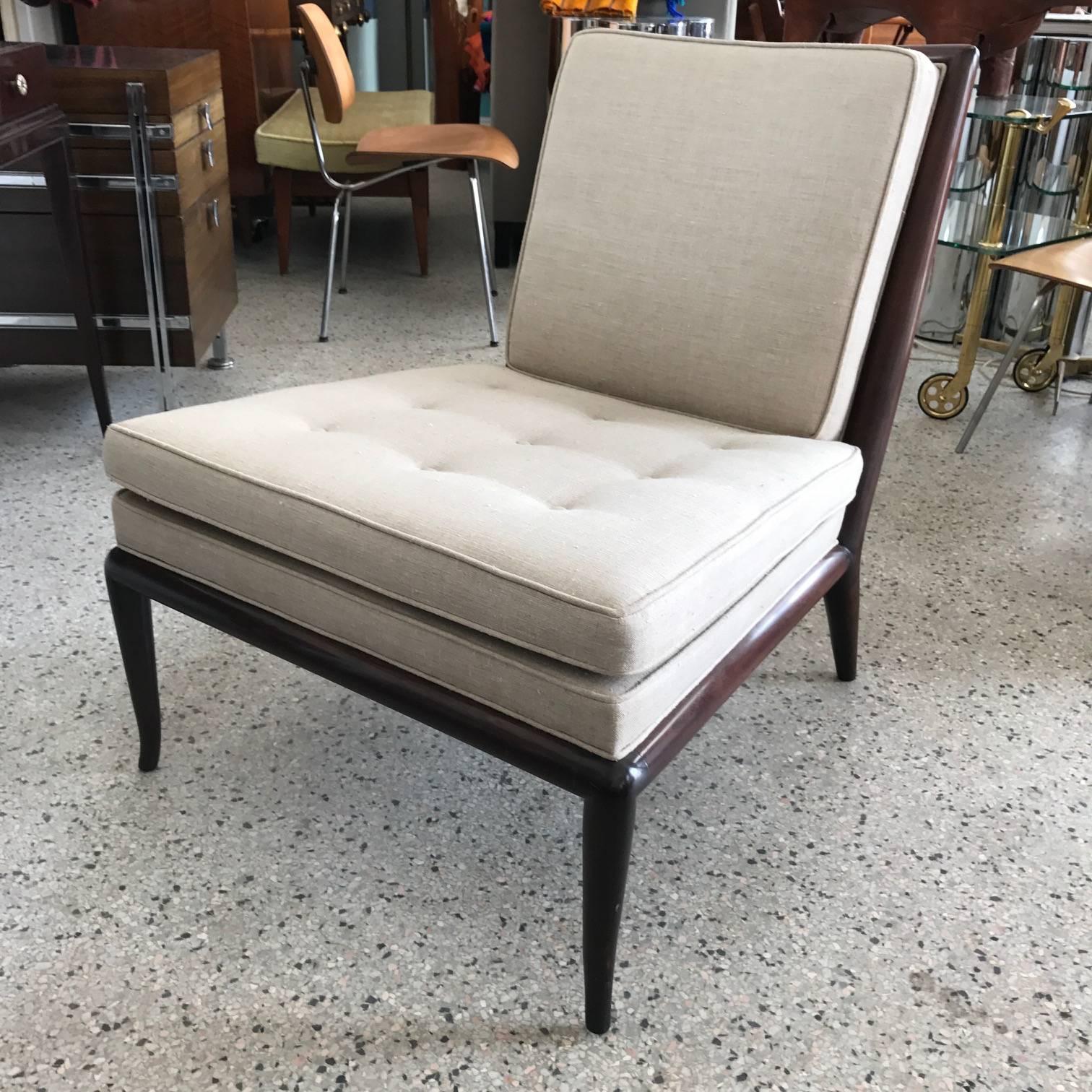 A pair of elegant, Classic slipper chairs designed by T.H. Robsjohn-Gibbings for Widdicomb Furniture Co. walnut frames with new linen upholstery. Medium or dark brown finish.