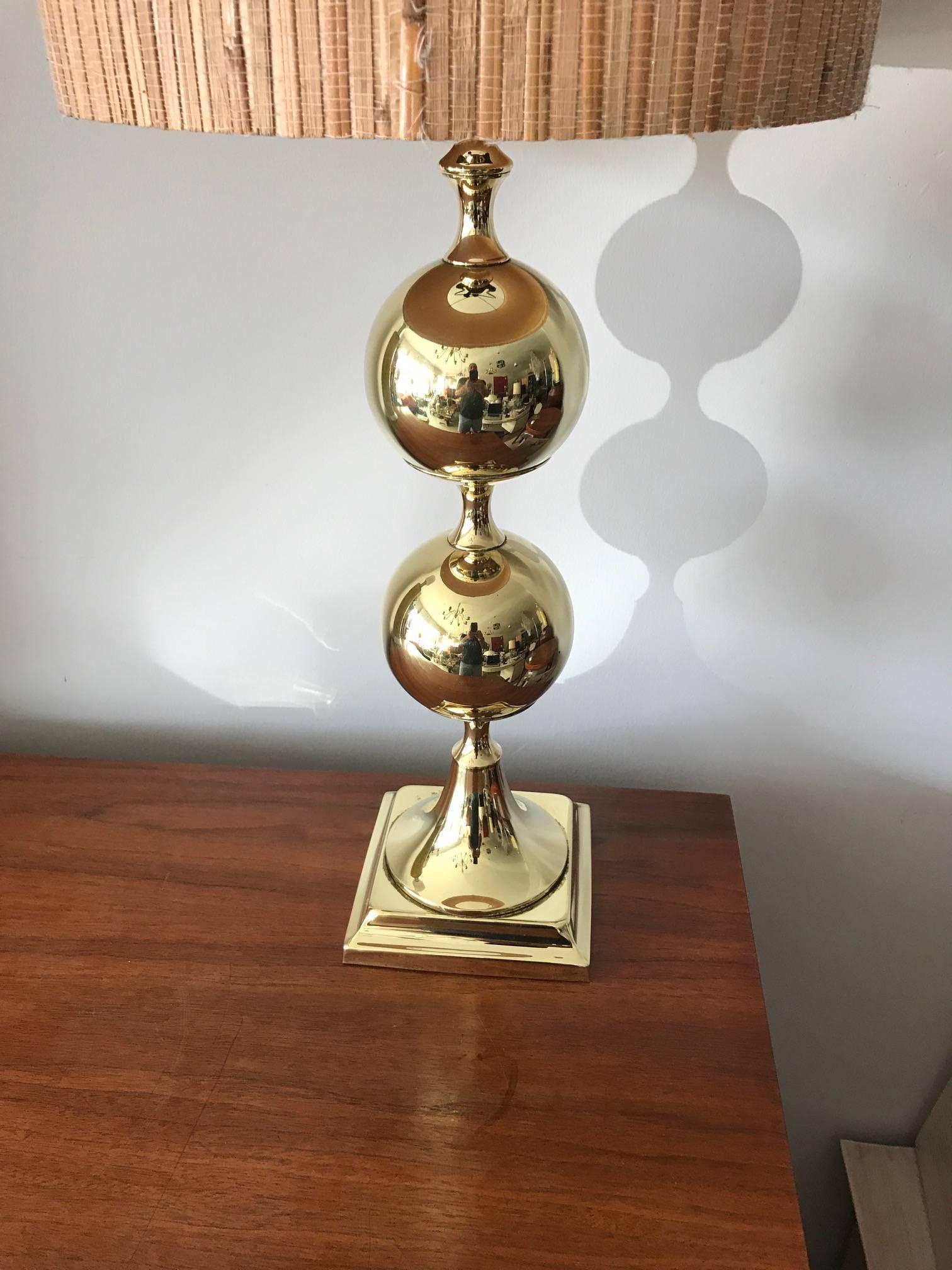 An unusual polished brass table lamp by Tower Craftsman, Red Bank, N.J. circa 1960s. In the style of Tommi Parzinger-well made, with original finial.