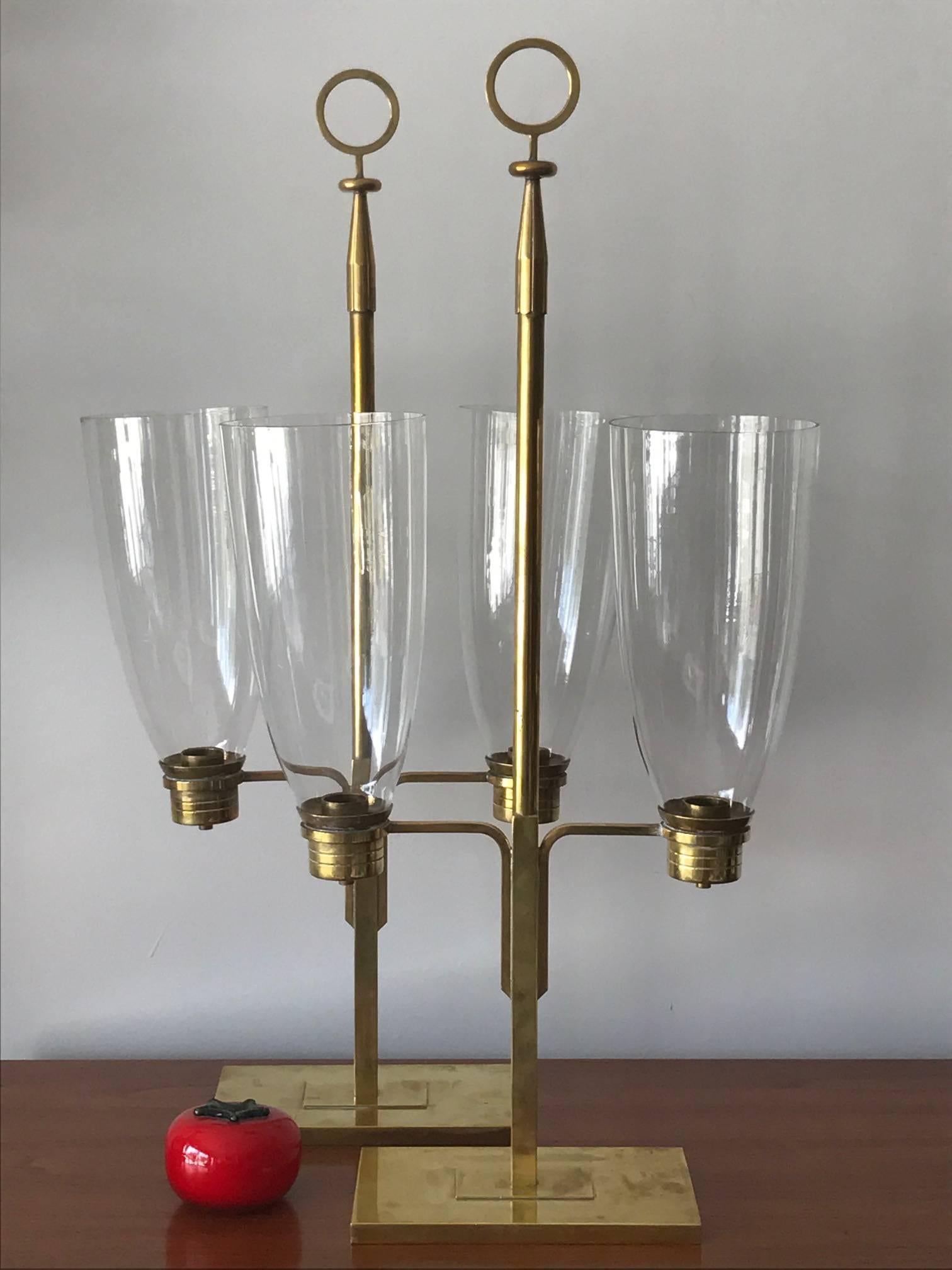 A pair of hurricane lamps by Tommi Parzinger. Manufactured by Dorlyn Silvermiths.