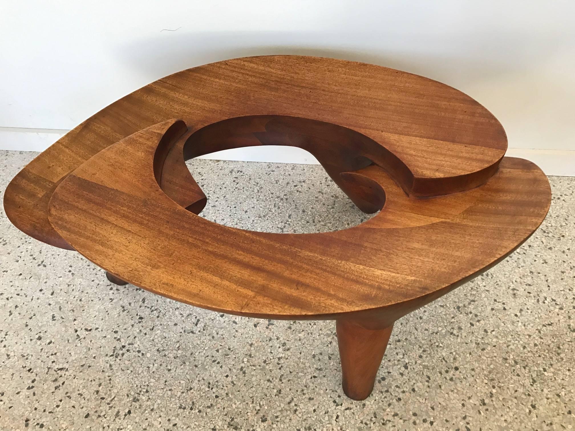A fantastic, one-off coffee table by master studio craftsman Sam Forrest, circa 1969. Solid mahogany. Signed underneath and authenticated by the arist as one of his earliest, important pieces.