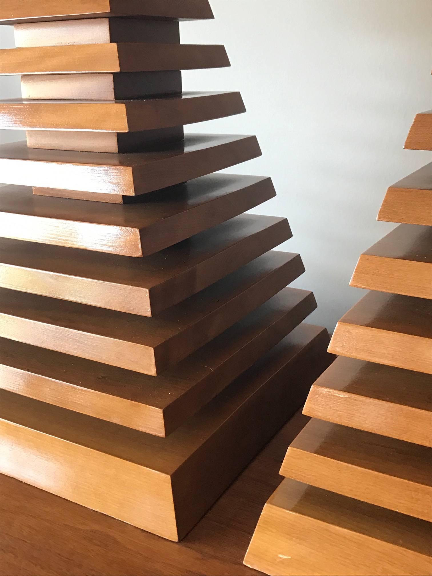 A pair of unusual, stacked walnut pyramid lamps. Well made and heavy, measuring approx. 12.5x12.5x16" (to top of base).