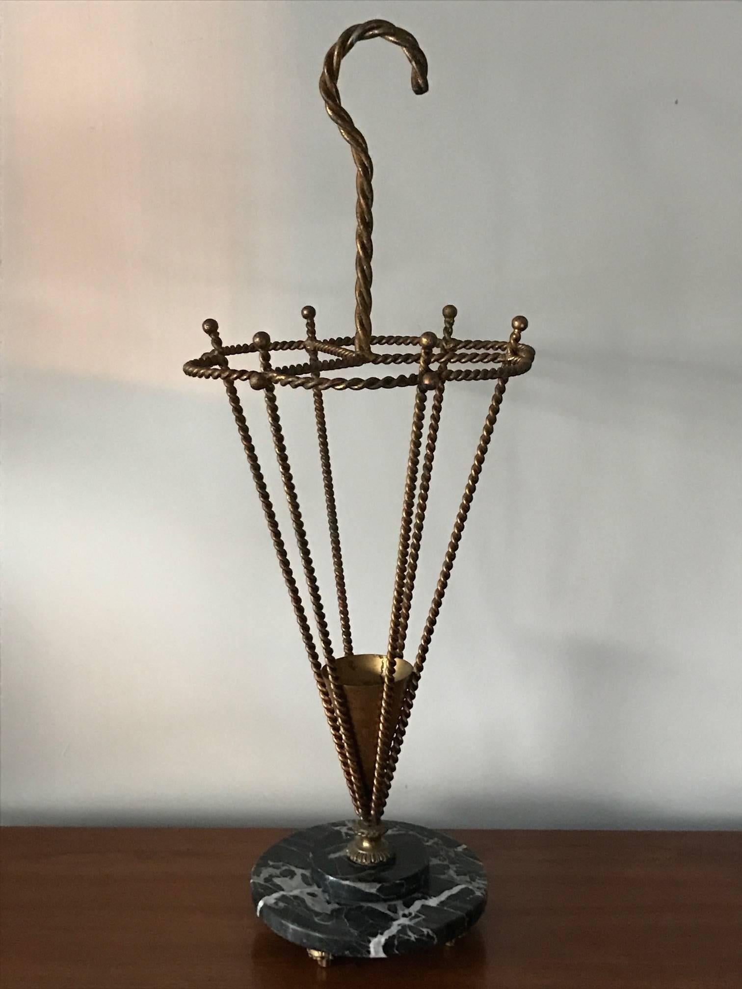 An elegant Italian umbrella stand with marble base. Gilt metal. Heavy and well-made, circa 1950s.
