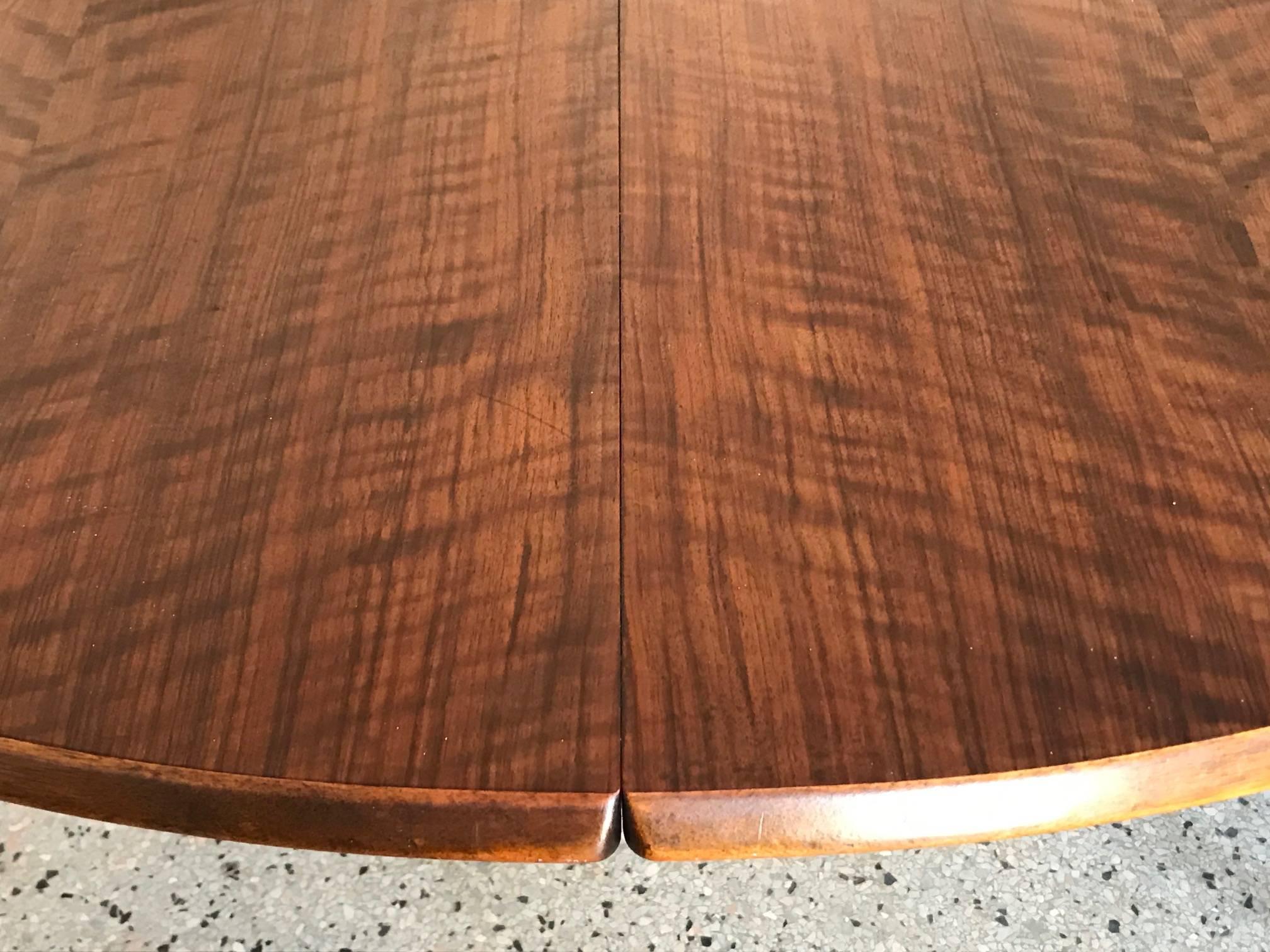 A fine Kurt Ostervig Danish dining table. Highly figured walnut with two leaves (21.5