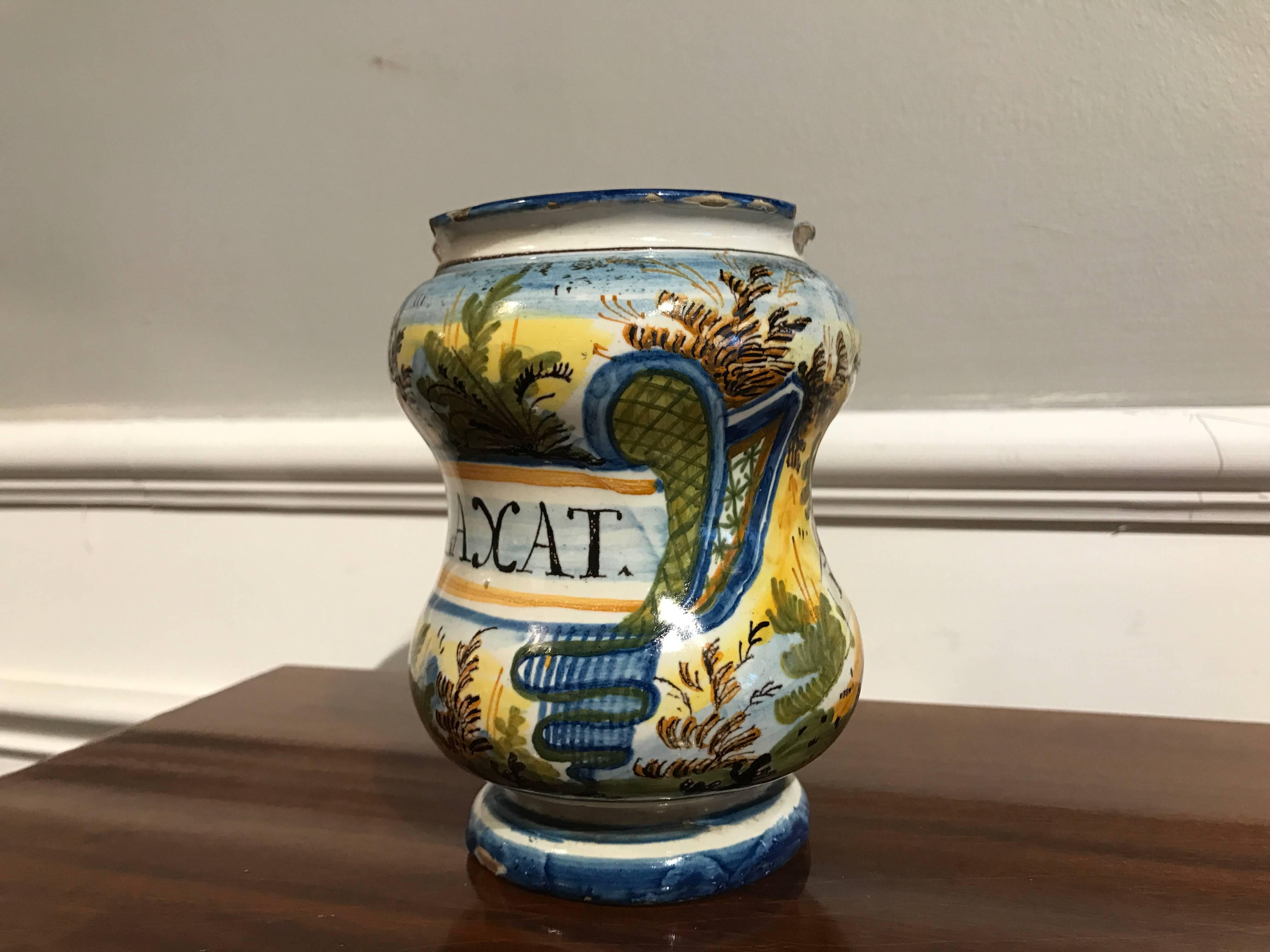 An Italian Baroque Castelli albarllo, also known as a pharmacy or drug jar. It held 'Benedict Laxat' listed as far back as Aristotle as a medication used in by midwives. Beautifully decorated with buildings in landscapes in the free, almost