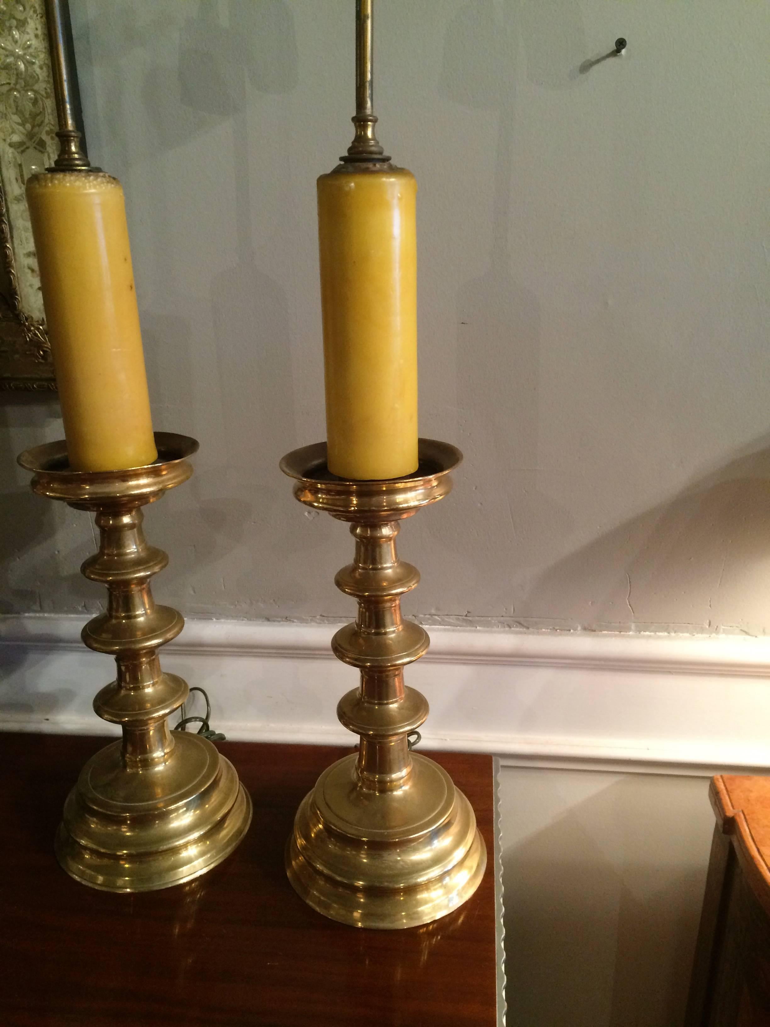 Handsome pair of beautifully turned Italian Baroque style brass candlestick lamps.