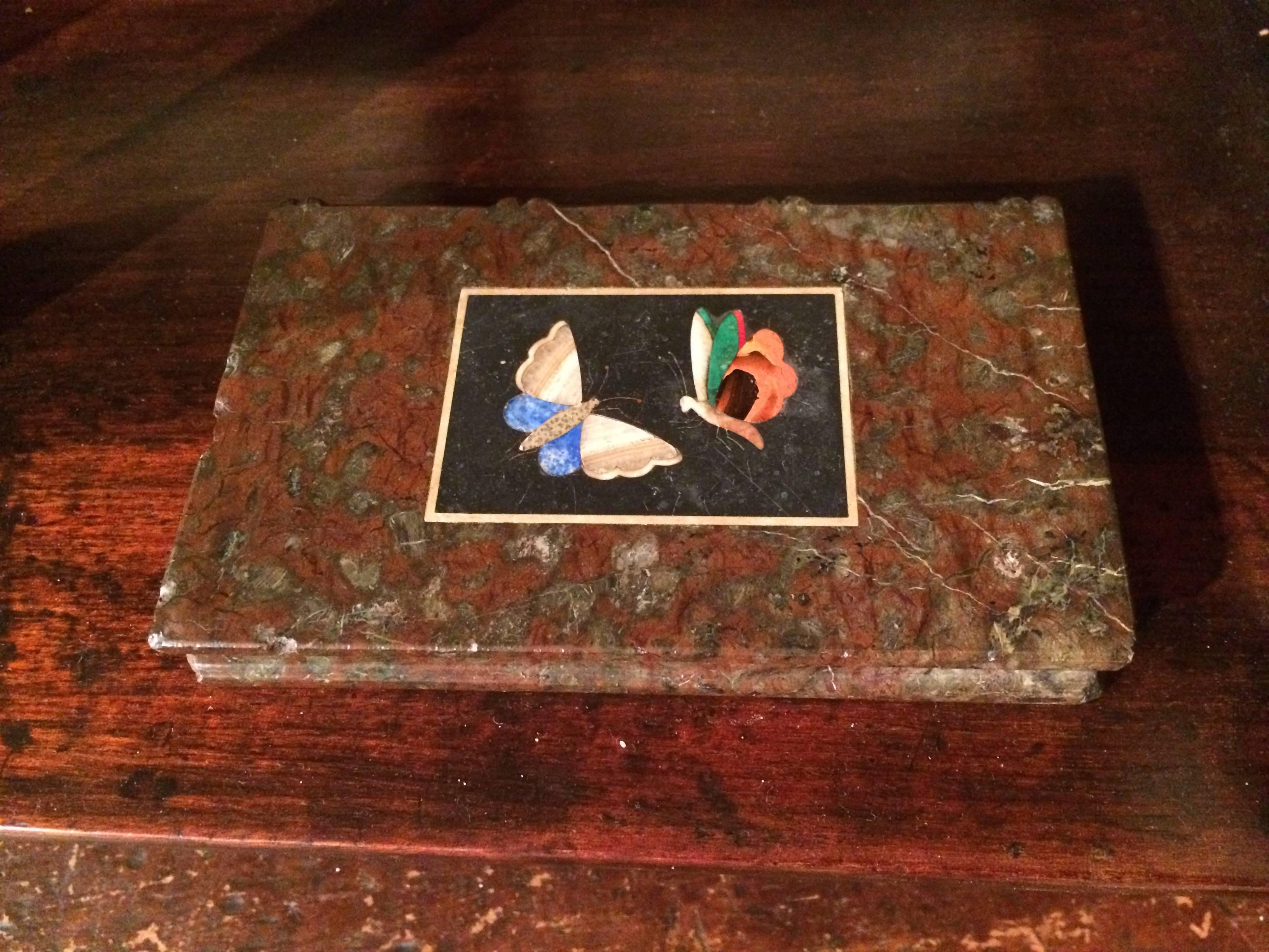 Italian book-form marble paperweight with beautiful Pietra Dura inlaid butterflies. The red and green marble carved to mimic a small book.