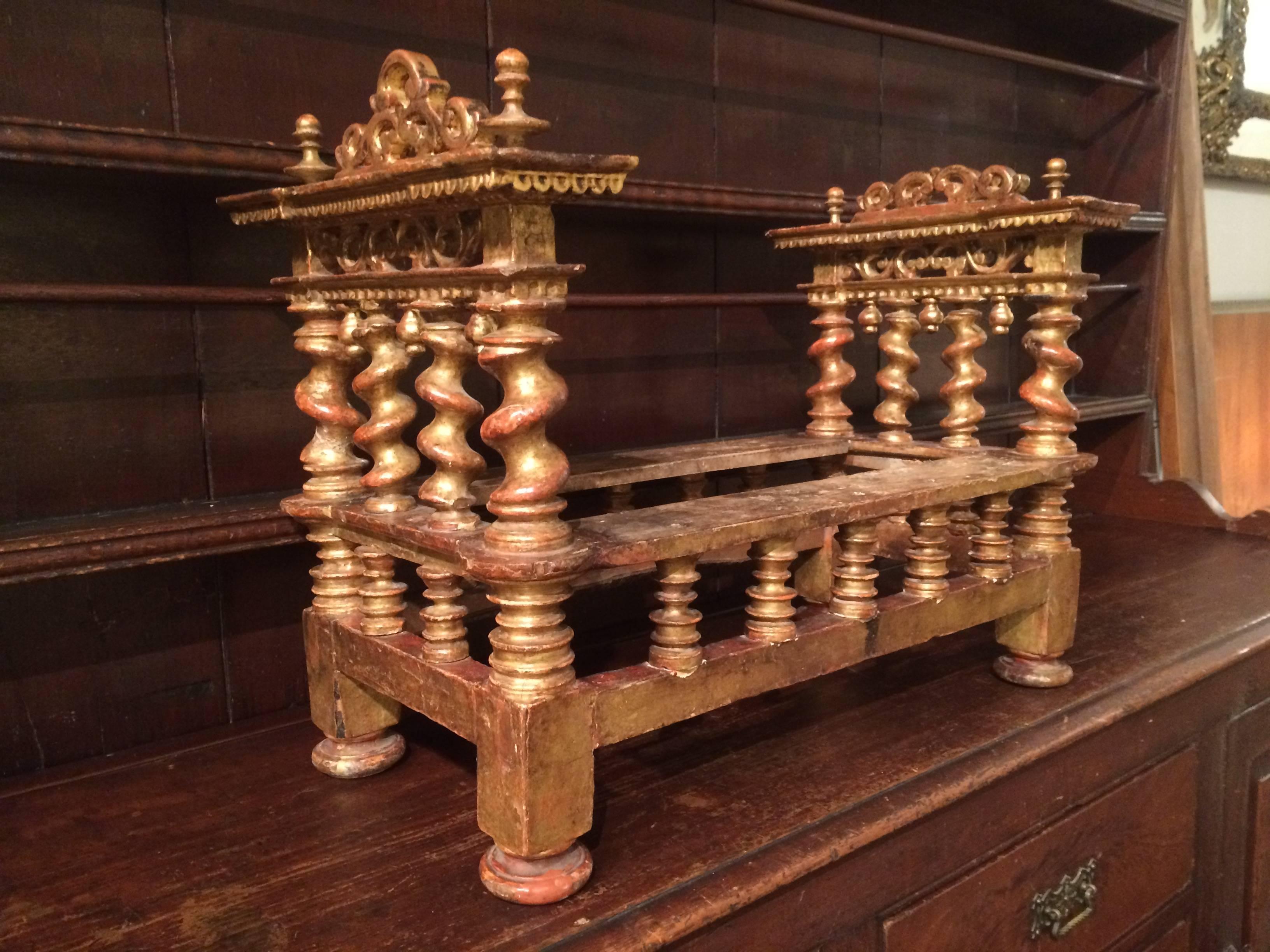 Unusual 18th century Italian baroque gilt wood  bed or possibly dog bed with exuberant carving and Solomonic columns. The bed was most likely made for a carving of 'El Nino', the Christ Child. A wonderful piece of workmanship.